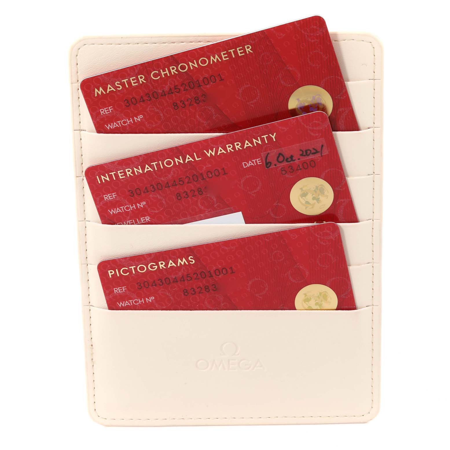 The image shows three red Omega Speedmaster 304.30.44.52.01.001 Men
s Stainless Steel Black Dial 304.30.44.52.01.001 Men
s Stainless Steel Black Dial warranty and certification cards in a white Omega cardholder.