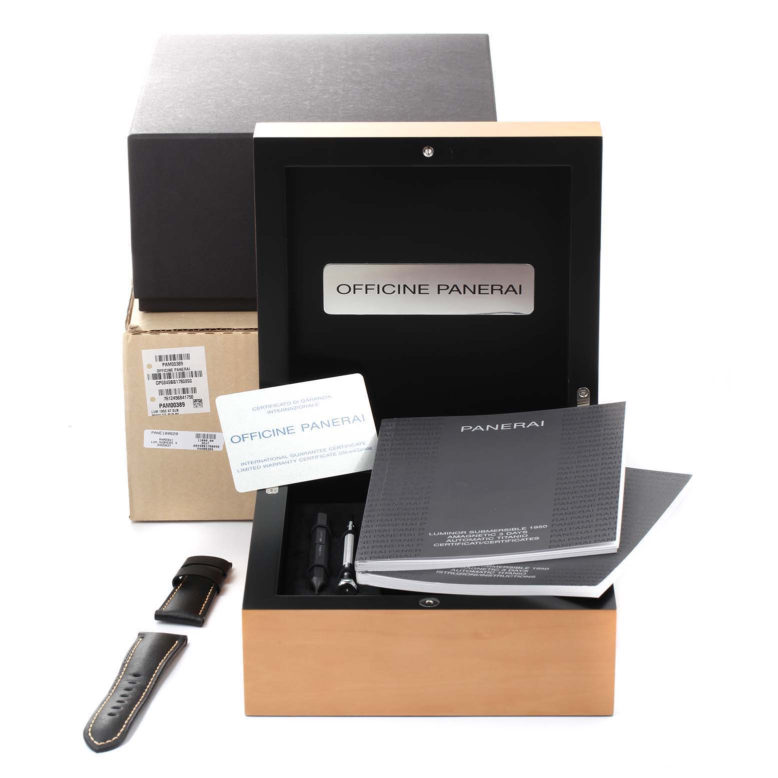 This image shows the packaging and accessories for a Panerai Submersible PAM00389 Men's Titanium Black Dial PAM00389 Men's Titanium Black Dial watch, including manuals, warranty card, tools, and a strap.