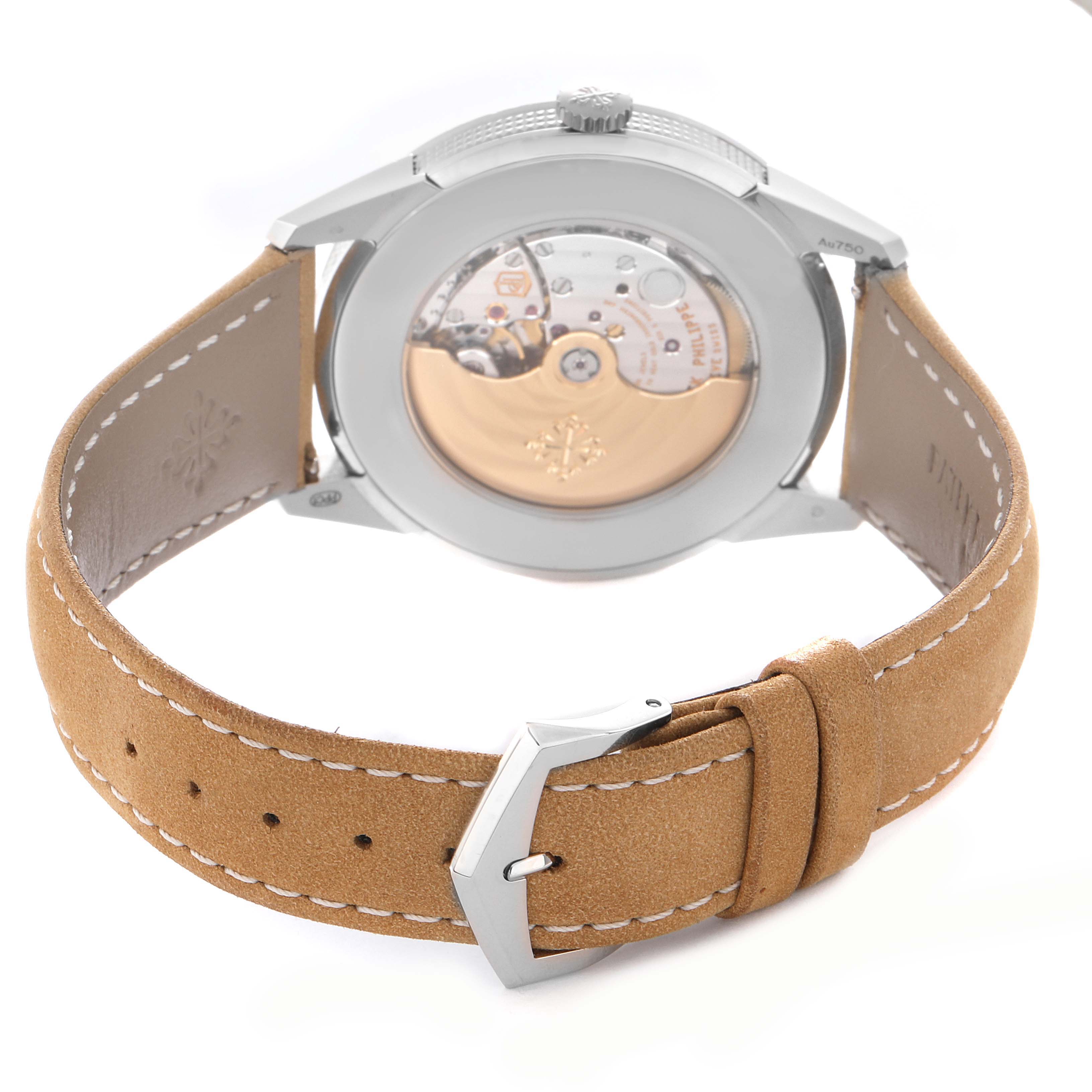 The Patek Philippe Calatrava 5226G-001 Men
s White Gold Grey Dial 5226G-001 Men
s White Gold Grey Dial watch is shown from the back, revealing the movement and showcasing the tan leather strap and buckle.