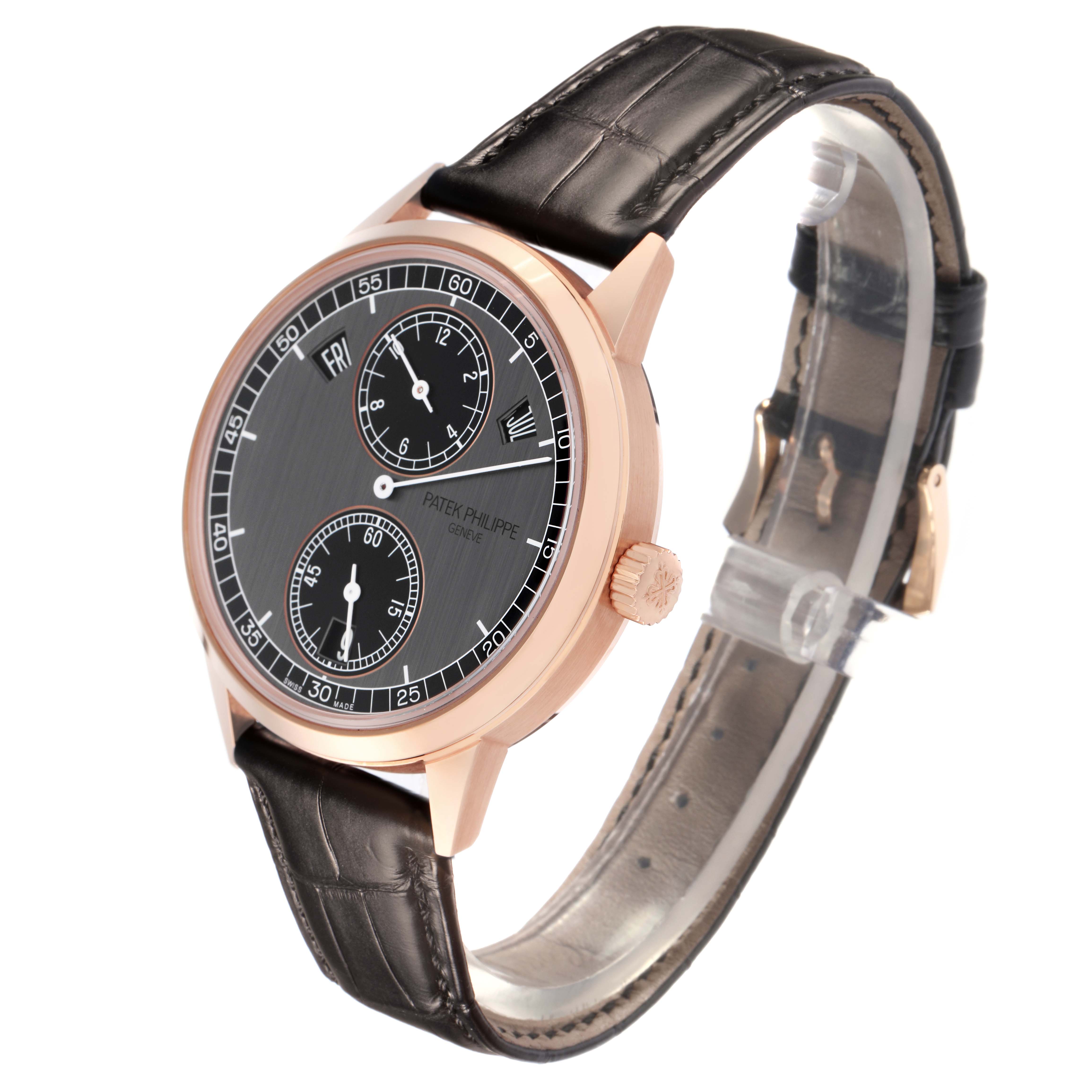 The Patek Philippe Complications 5235/50R-001 Men
s Rose Gold Black Dial 5235/50R-001 Men
s Rose Gold Black Dial watch is shown at a three-quarter angle, displaying the dial, crown, and leather strap.