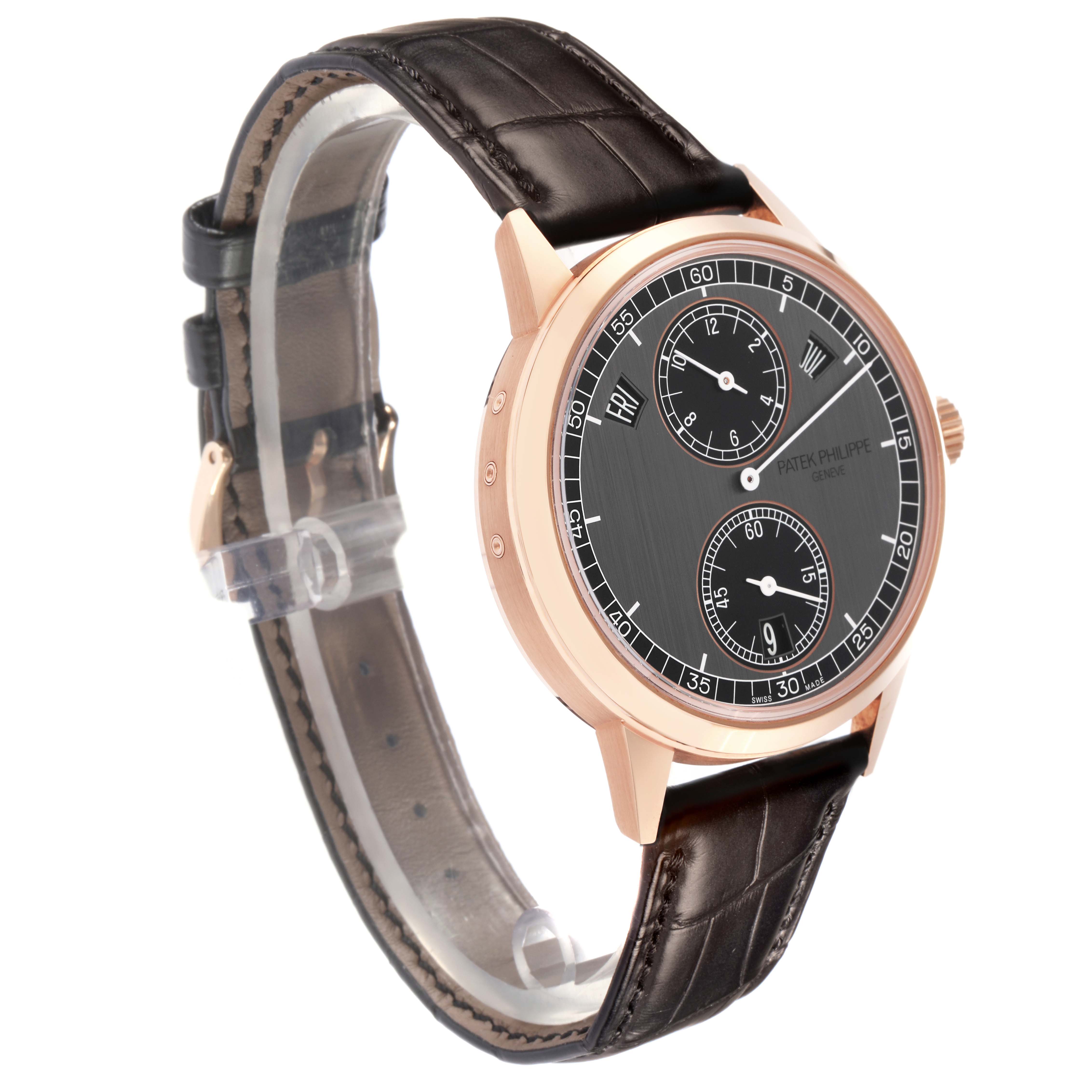 The Patek Philippe Complications 5235/50R-001 Men
s Rose Gold Black Dial 5235/50R-001 Men
s Rose Gold Black Dial watch is shown at a side angle, displaying the face, bezel, and part of the strap.