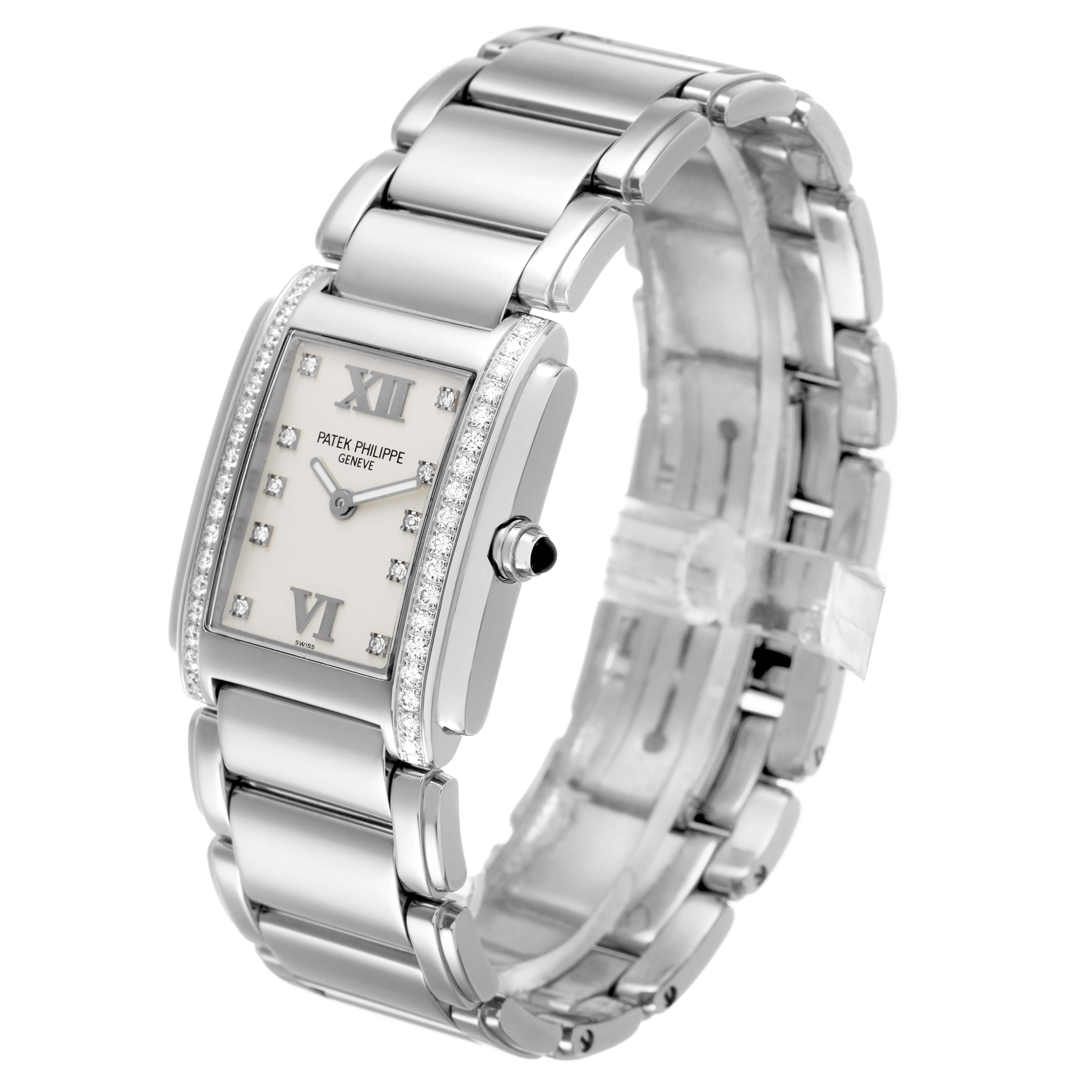 The Patek Philippe Twenty-4 4910/10A-011 Women's Stainless Steel Silver Dial watch is shown at an angle highlighting the face, bracelet, and side profile with diamonds on the bezel.