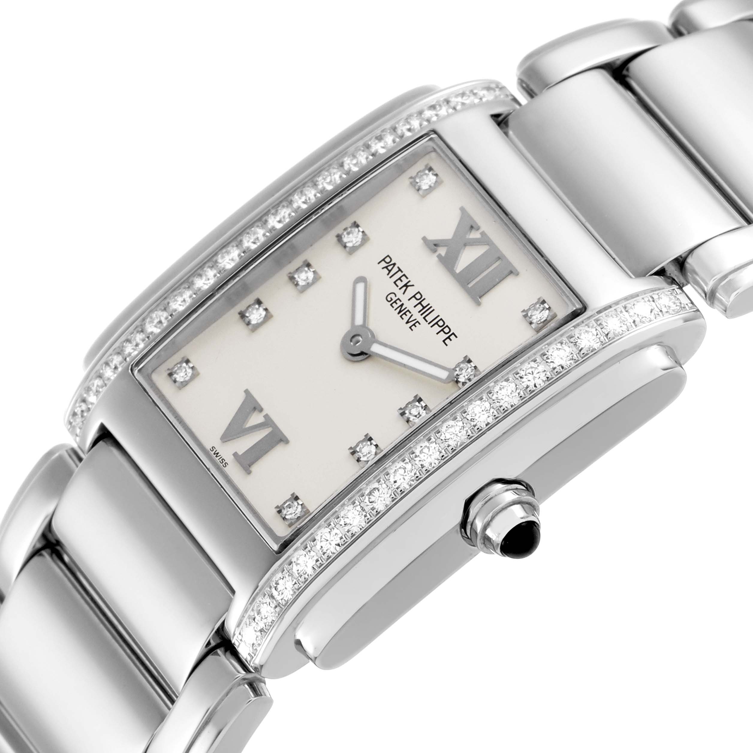The Patek Philippe Twenty-4 4910/10A-011 Women's Stainless Steel Silver Dial watch is shown at an angled close-up, highlighting the diamond-set bezel and part of the bracelet.