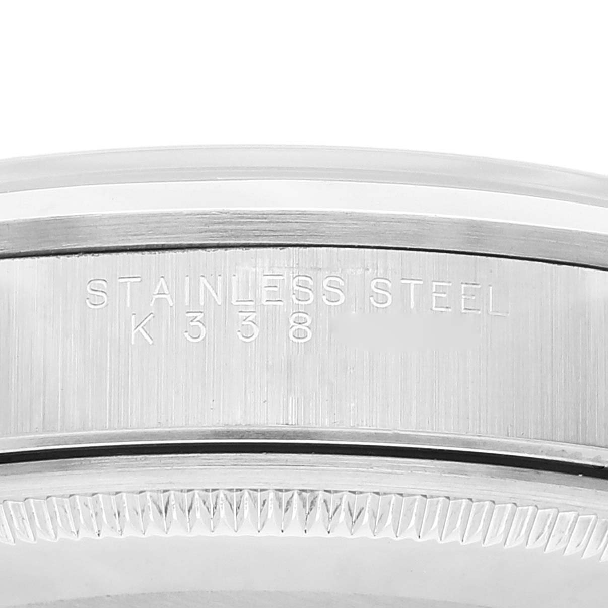 The image shows a close-up of the stainless steel bezel and engraved serial number of a Rolex Air-King 14000 Men's Stainless Steel Silver Dial 14000 Men's Stainless Steel Silver Dial watch.