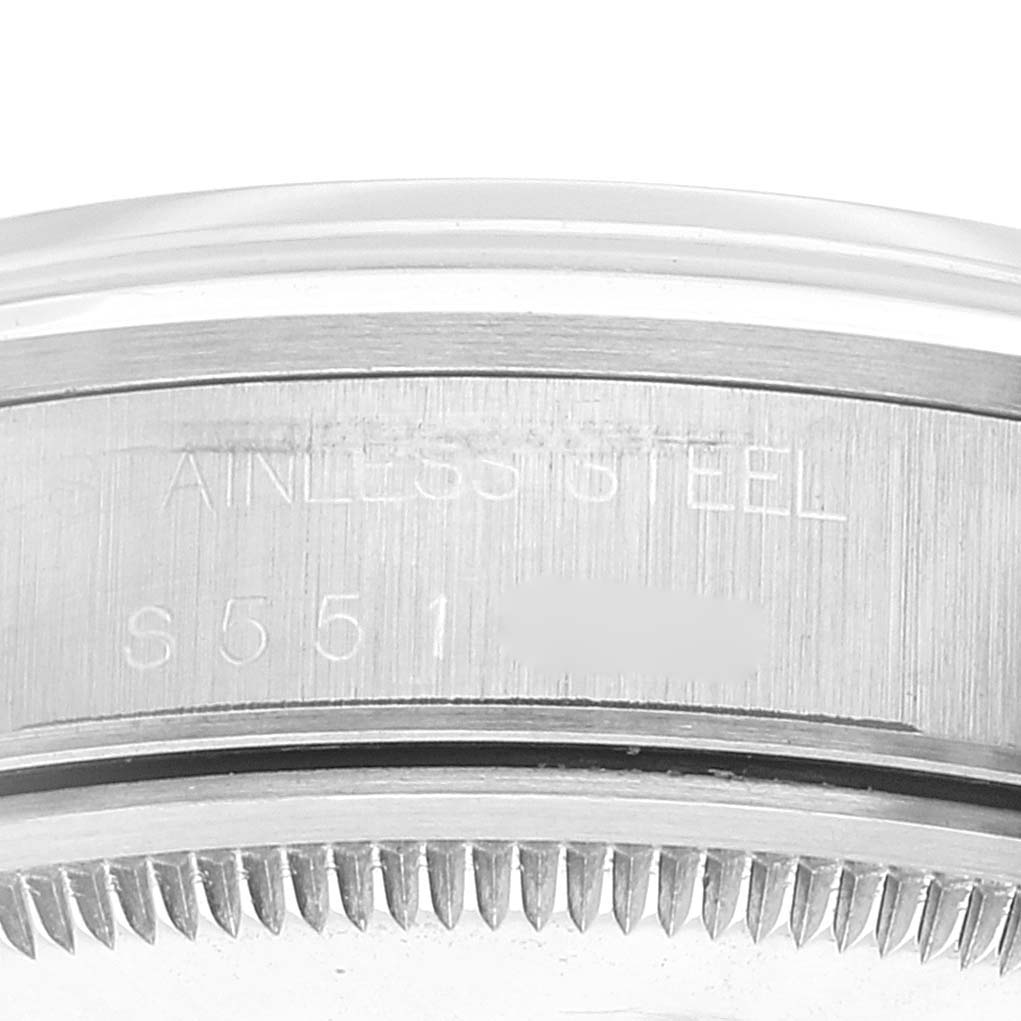 The image shows a close-up of the case side of a Rolex Air-King 14000 Men's Stainless Steel White Dial 14000 Men's Stainless Steel White Dial watch, highlighting the serial number and stainless steel inscription.