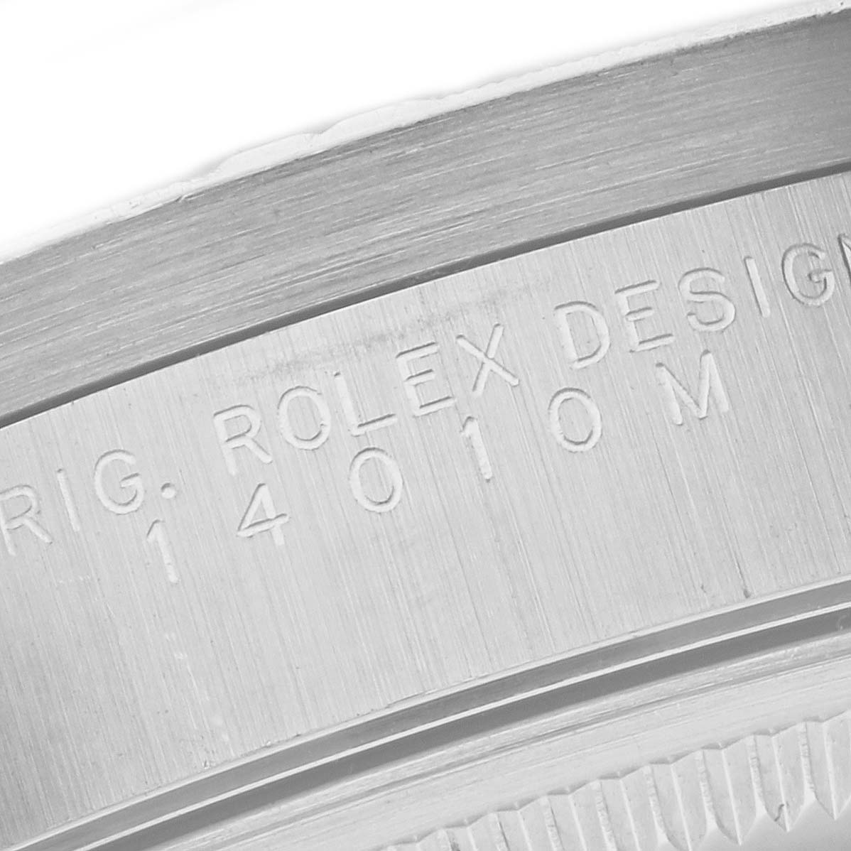 The image shows a close-up of the engraved model number on the case of a Rolex Air-King 14010M Men's Stainless Steel White Dial 14010M Men's Stainless Steel White Dial watch.