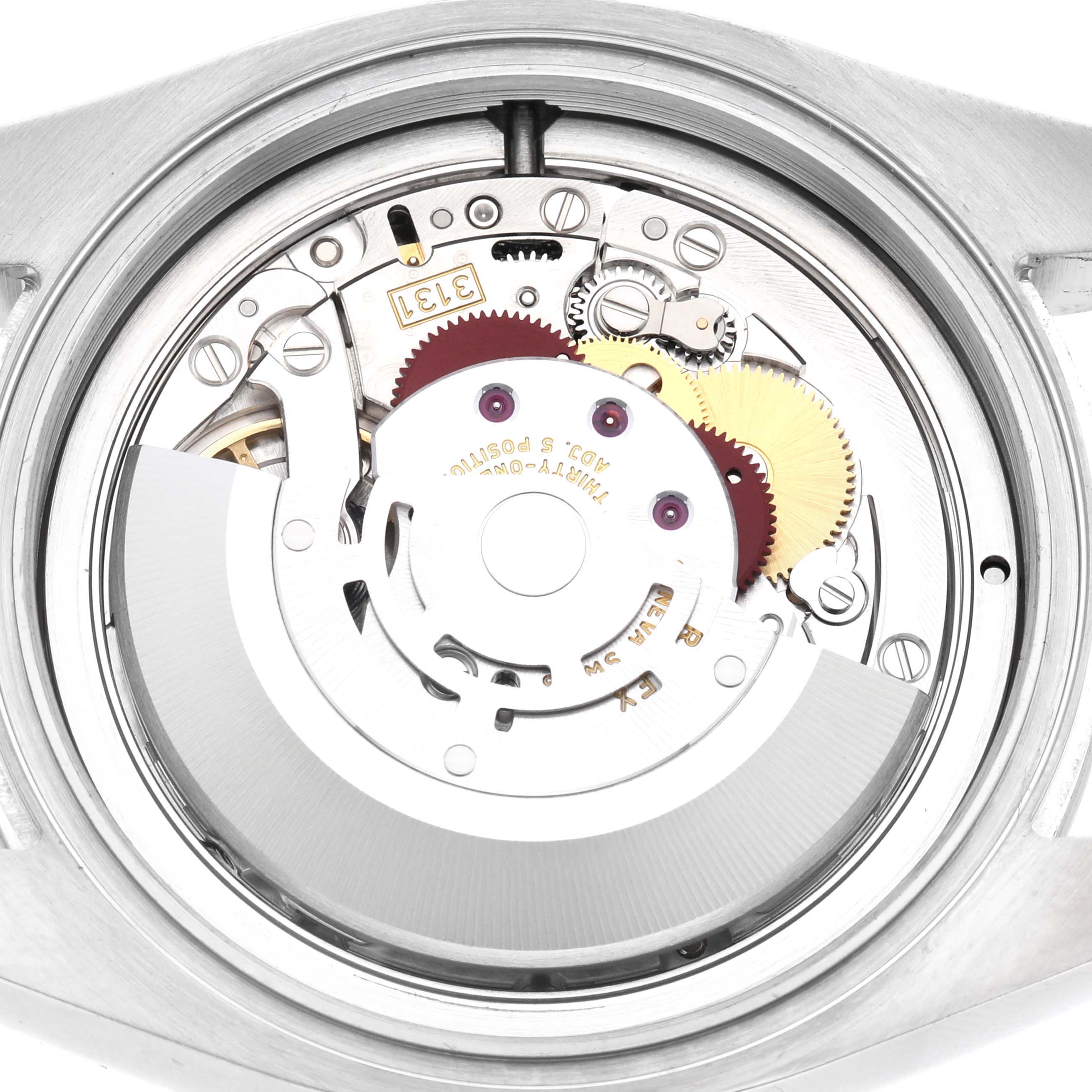 The image shows the internal mechanism of a Rolex Air-King 116900 Men's Stainless Steel Black Dial 116900 Men's Stainless Steel Black Dial, focusing on gears and the rotor from a top-down angle.