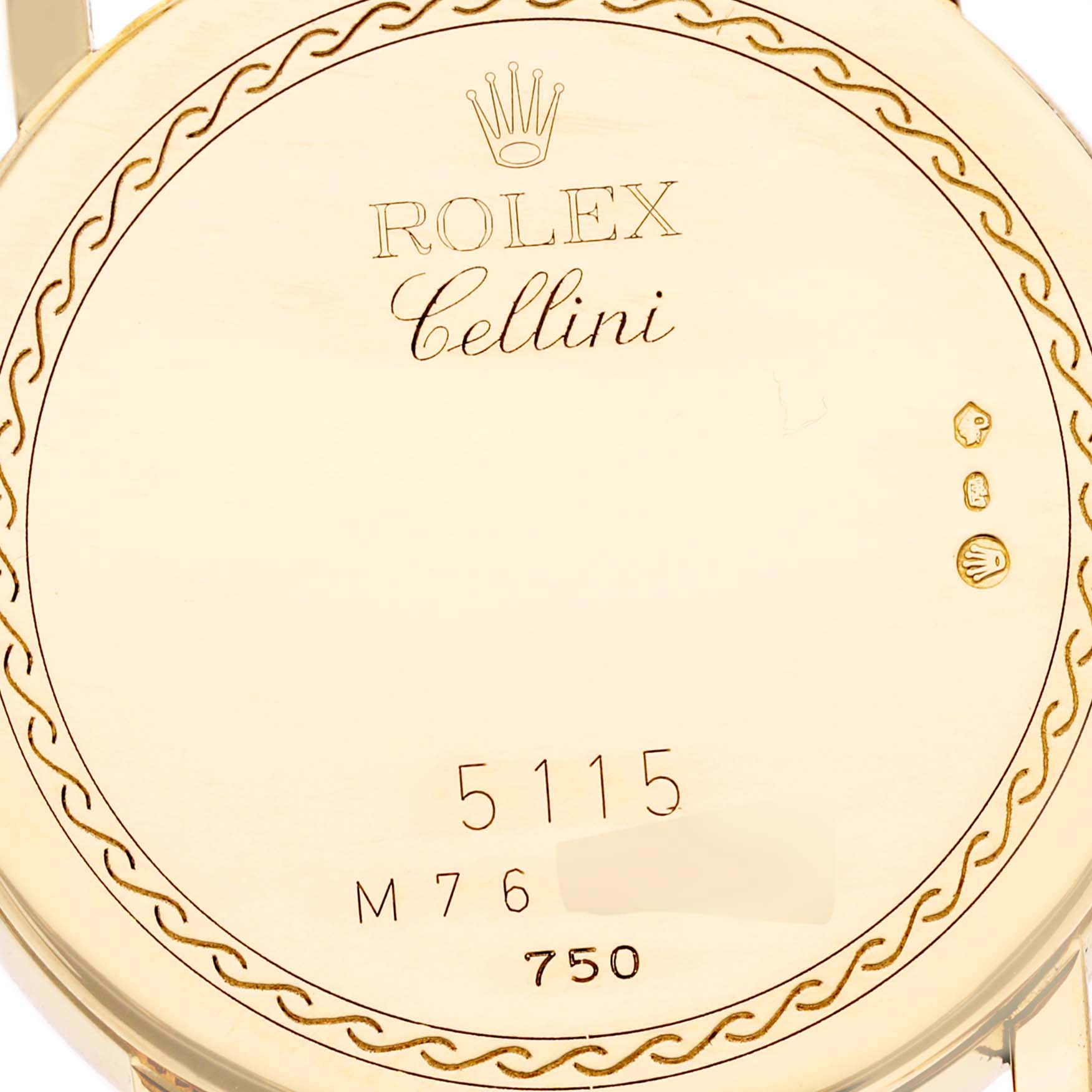 The image shows the back case of a Rolex Cellini 5115 Men's Yellow Gold Black Dial 5115 Men's Yellow Gold Black Dial model watch, displaying the brand logo, model number, and hallmarks.