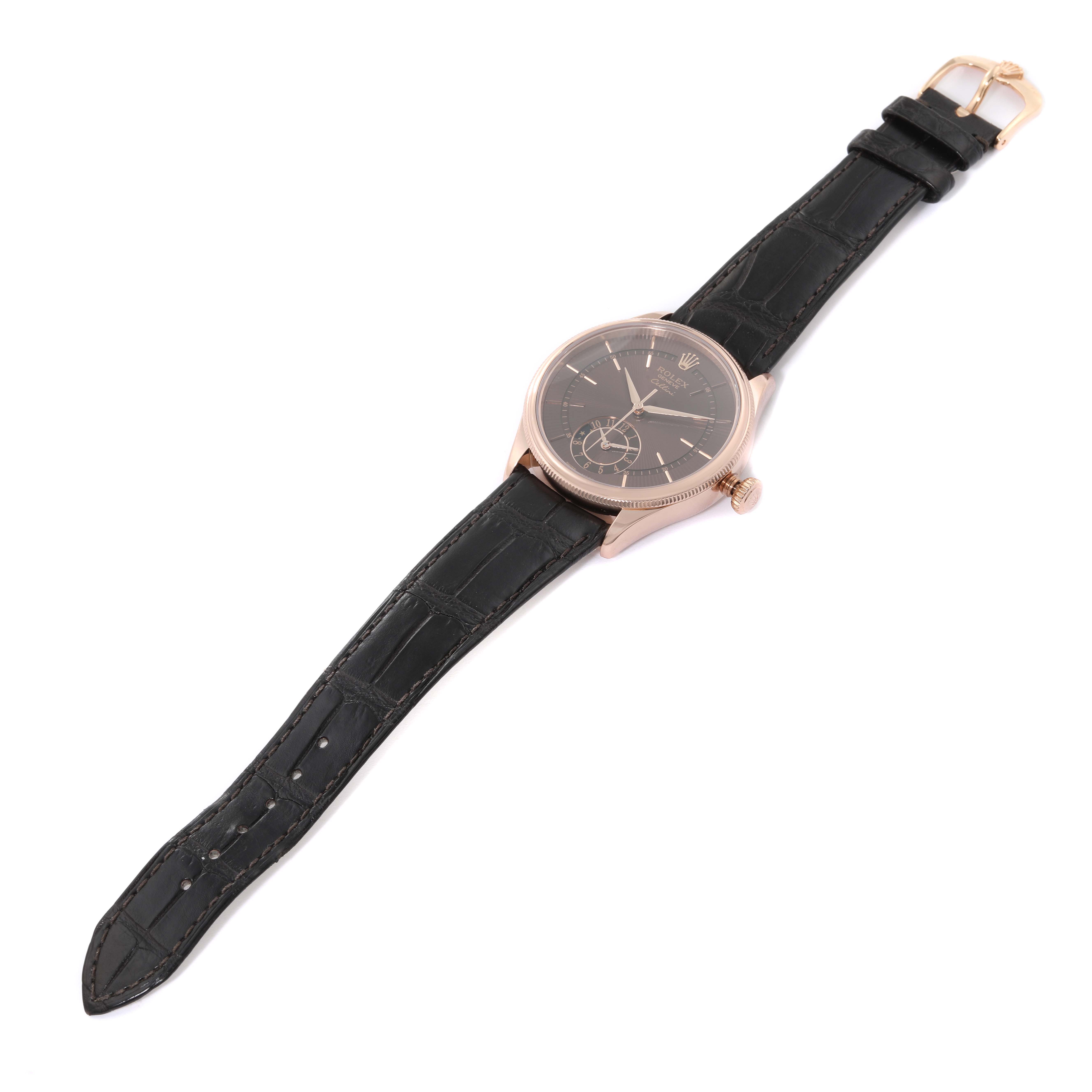The Rolex Cellini 50525 Men's Rose Gold Brown Dial 50525 Men's Rose Gold Brown Dial watch is shown lying flat, displaying the face, black leather strap, and gold buckle.