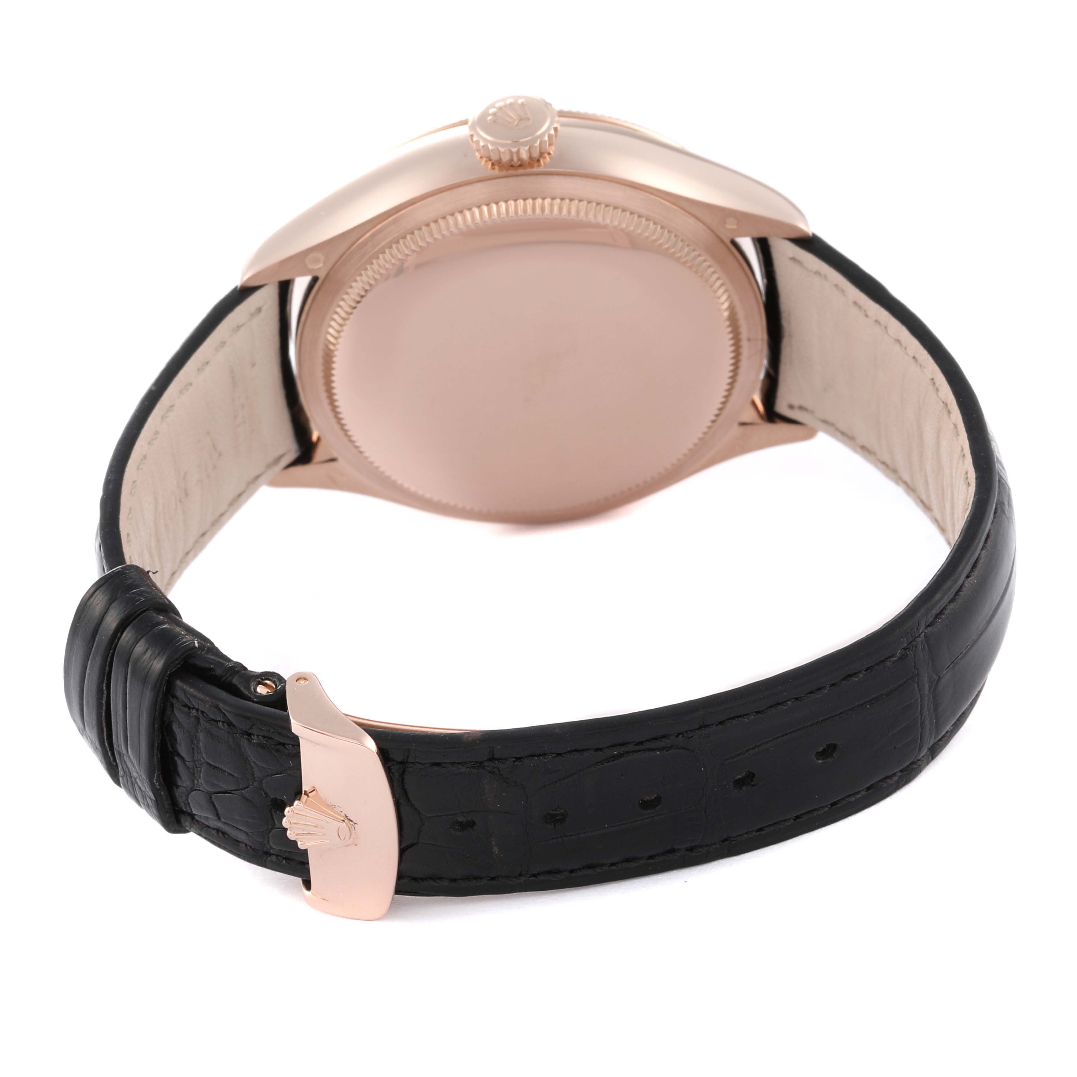 The image shows the back view of a Rolex Cellini 50535 Men
s Yellow Gold White Dial 50535 Men
s Yellow Gold White Dial watch, highlighting the case back, crown, and black leather strap with a clasp.