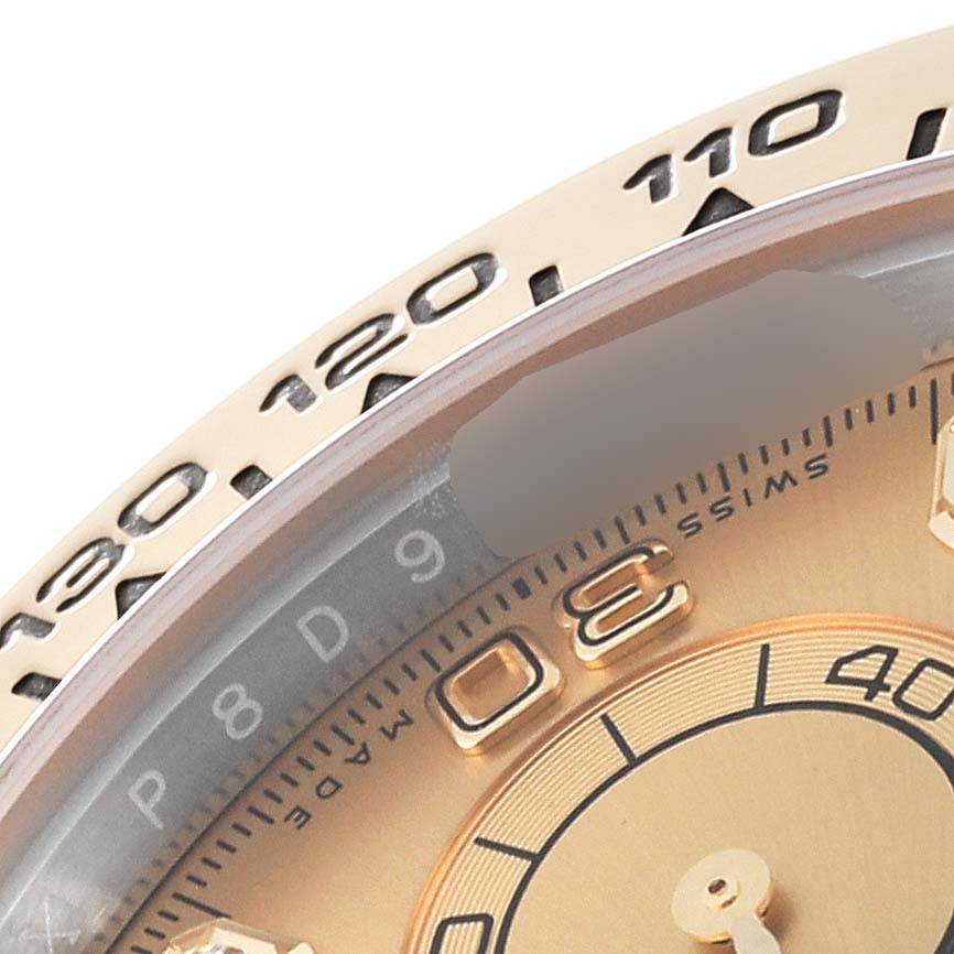 The image shows a close-up of the bezel and part of the dial of a Rolex Daytona 116503 Men's Steel and Gold (two tone) Champagne Dial 116503 Men's Steel and Gold (two tone) Champagne Dial watch.