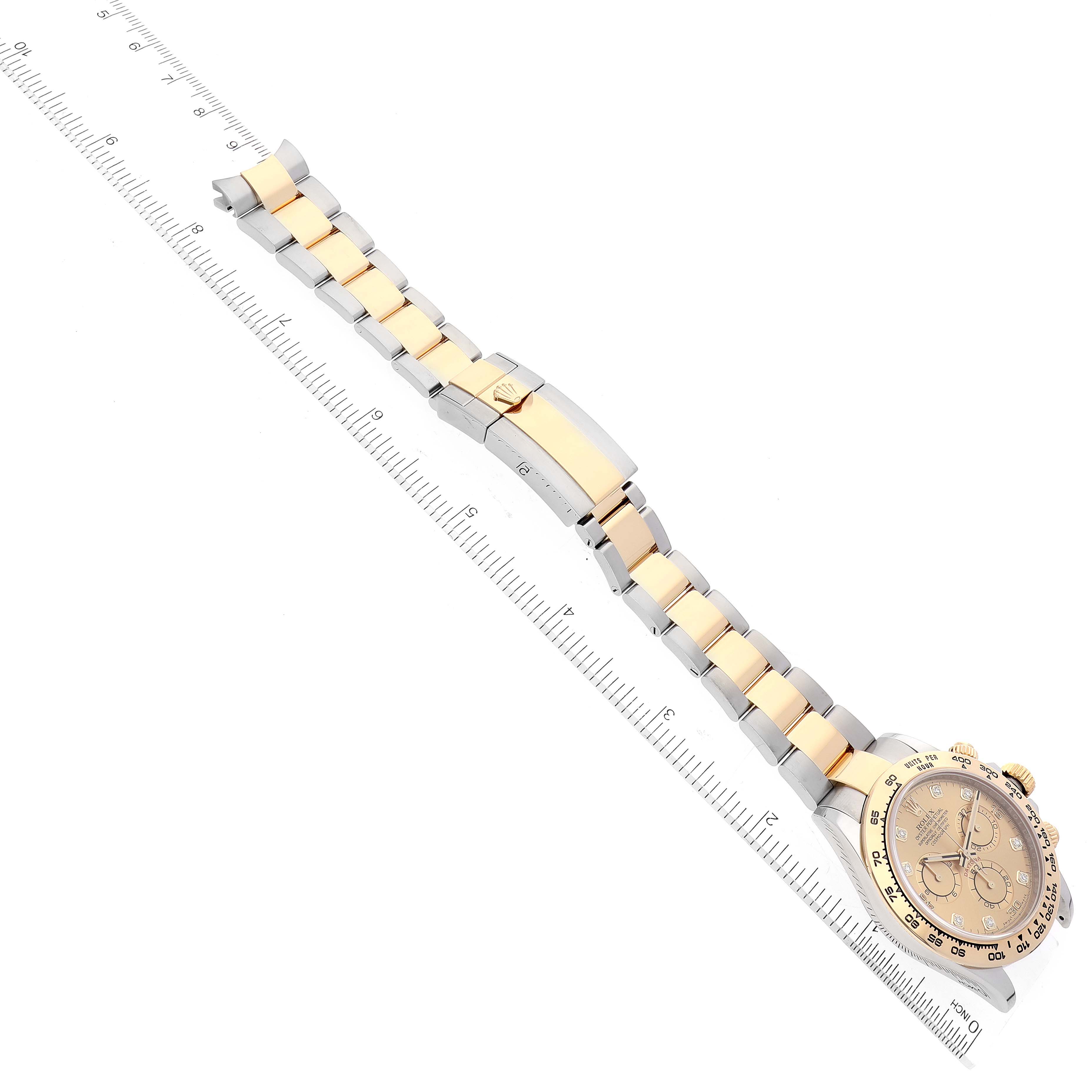 The image shows an overhead view of a Rolex Daytona 116503 Men's Steel and Gold (two tone) Champagne Dial 116503 Men's Steel and Gold (two tone) Champagne Dial watch, displaying its band with gold center links and its crown.