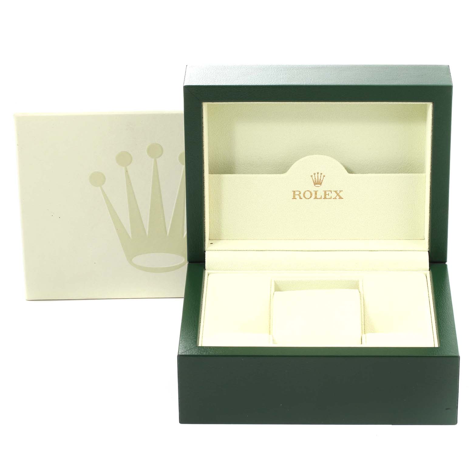 The image shows an open green and beige Rolex box for the Date model, viewed from the front.