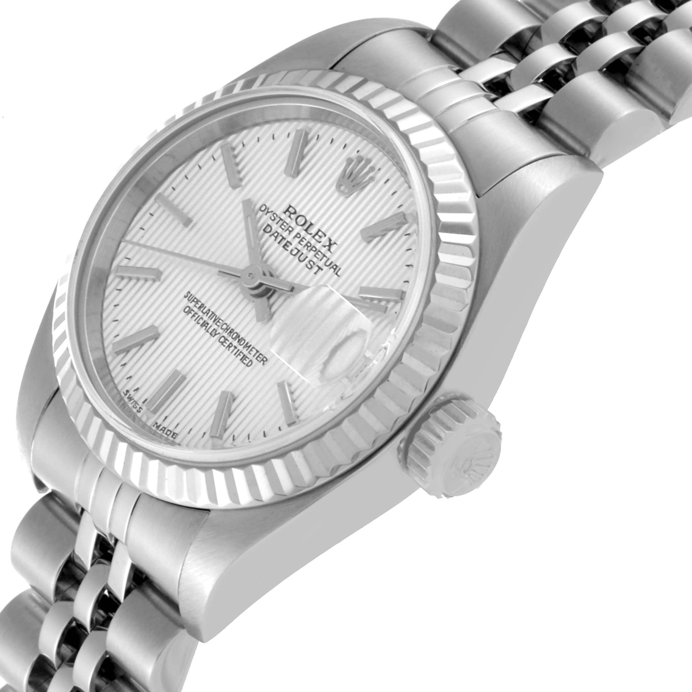 The image shows a side angle of a Rolex Datejust 79174 Women
s Stainless Steel Silver Dial 79174 Women
s Stainless Steel Silver Dial watch focused on the dial, bezel, crown, and part of the bracelet.