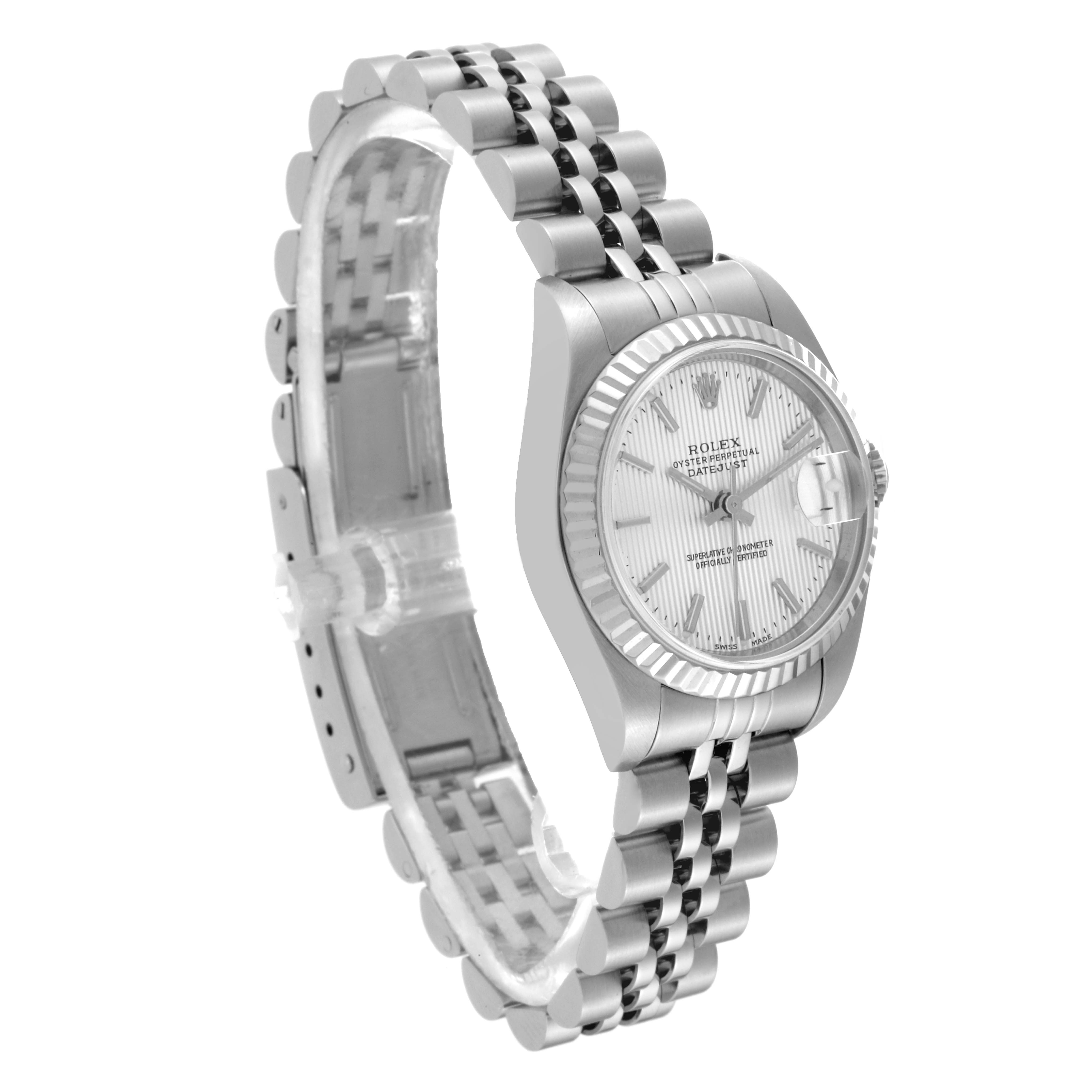 The Rolex Datejust 79174 Women
s Stainless Steel Silver Dial 79174 Women
s Stainless Steel Silver Dial watch is shown at a slight angle, highlighting the face, fluted bezel, and two-tone Jubilee bracelet.