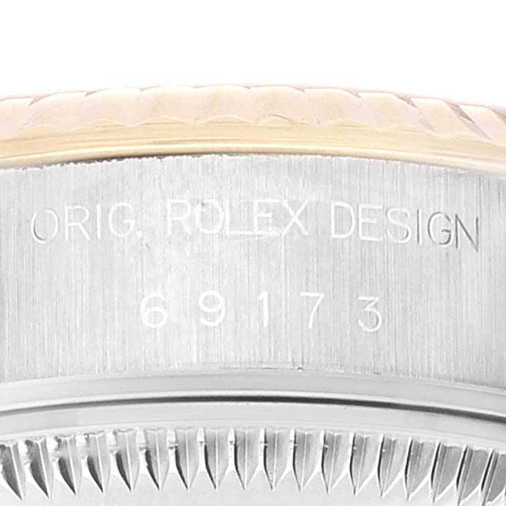 This is a close-up of the case side and bezel of the Rolex Datejust 69173 Women
s Steel and Gold (two tone) Champagne Dial 69173 Women
s Steel and Gold (two tone) Champagne Dial model, showing its model number engraved.