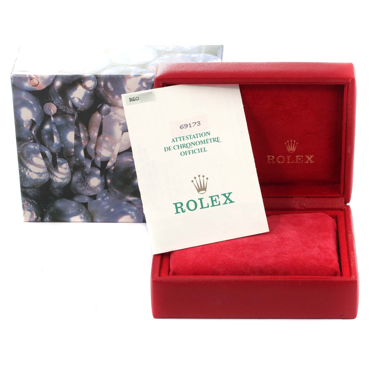 This image shows the packaging and certification for a Rolex Datejust 69173 Women
s Steel and Gold (two tone) Champagne Dial 69173 Women
s Steel and Gold (two tone) Champagne Dial model, including a box and a certificate.