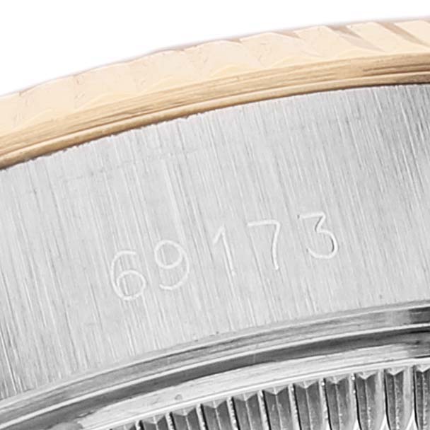 This image shows a close-up of the model number "69173" on the side of a Rolex Datejust 69173 Women
s Steel and Gold (two tone) Champagne Dial 69173 Women
s Steel and Gold (two tone) Champagne Dial watch bezel.