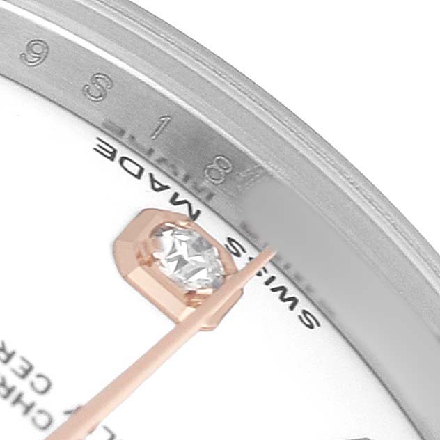 The image shows a close-up of a Rolex Mid-Size 178271 Women's Steel and Gold (two tone) White Dial watch, highlighting the dial with a diamond hour marker and "Swiss Made" text.