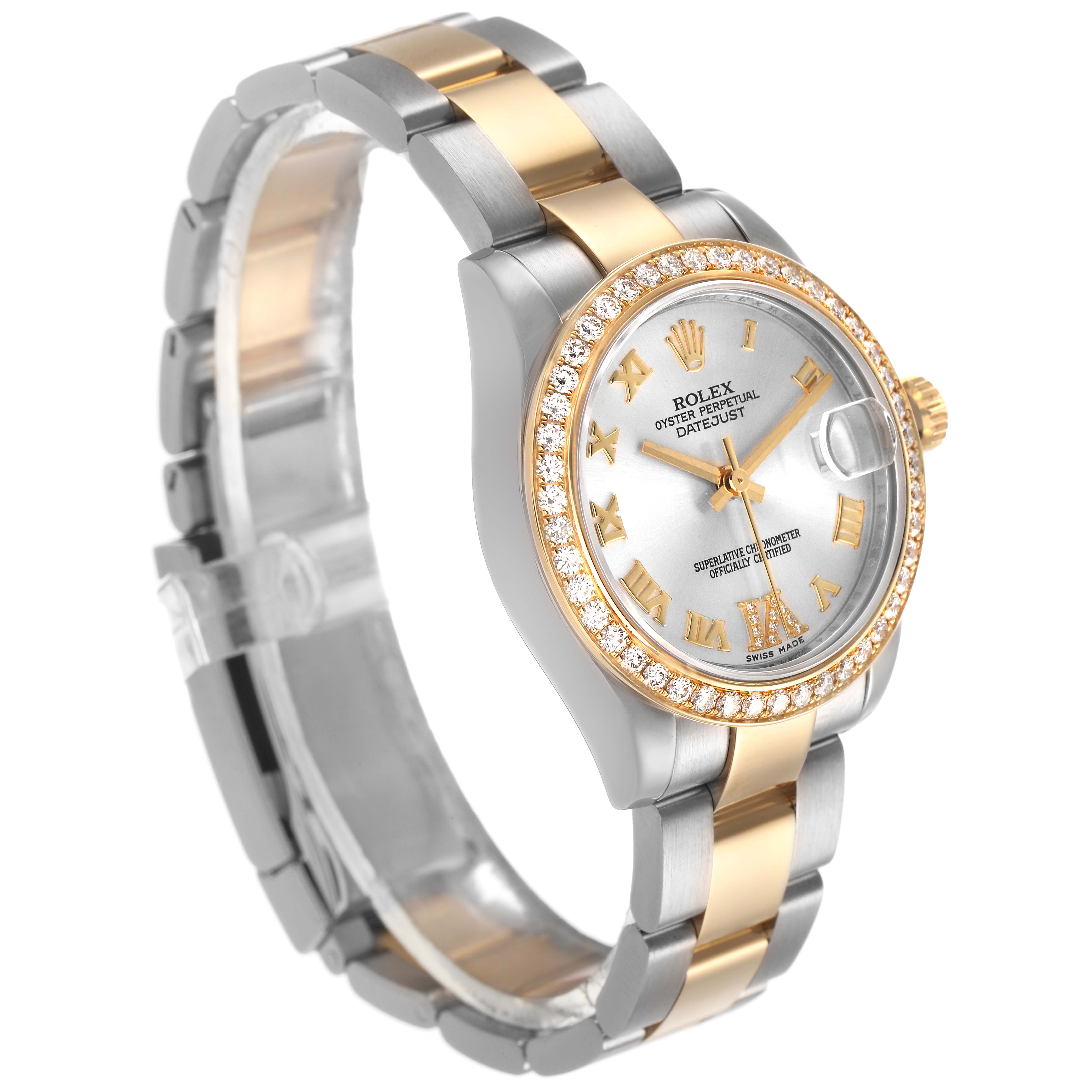 The Rolex Mid-Size 178383 Women's Steel and Gold (two tone) Silver Dial watch is shown at a side angle, displaying its two-tone band, a diamond bezel, and a silver dial with gold Roman numerals.