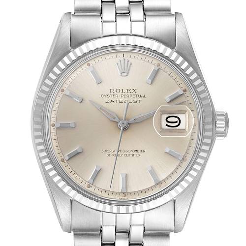 The Rolex Datejust watch is shown from a front angle displaying the dial, bezel, crown, and part of the bracelet.