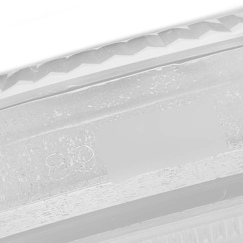 The image shows a close-up of the edge of the bezel and case of a Rolex Datejust 1601 Men
s Stainless Steel Silver Dial 1601 Men
s Stainless Steel Silver Dial watch.