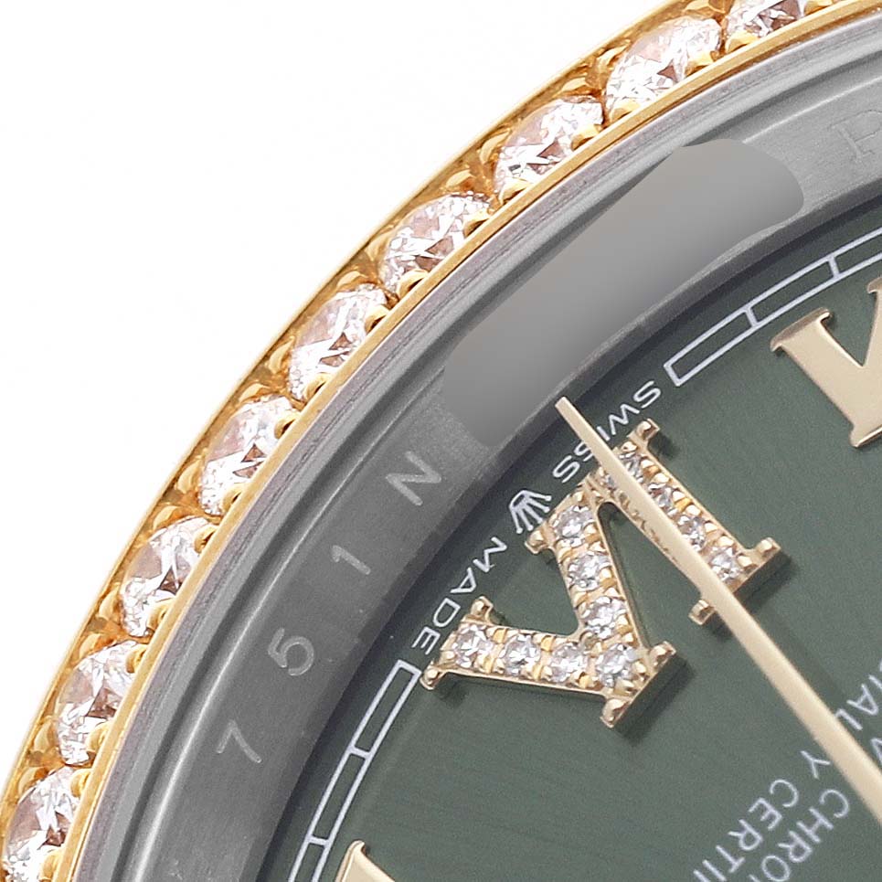 The image shows a close-up of the Rolex Datejust 126283 Women's Steel and Gold (two tone) Green Dial watch face focusing on the bezel set with diamonds and part of the dial with Roman numerals.