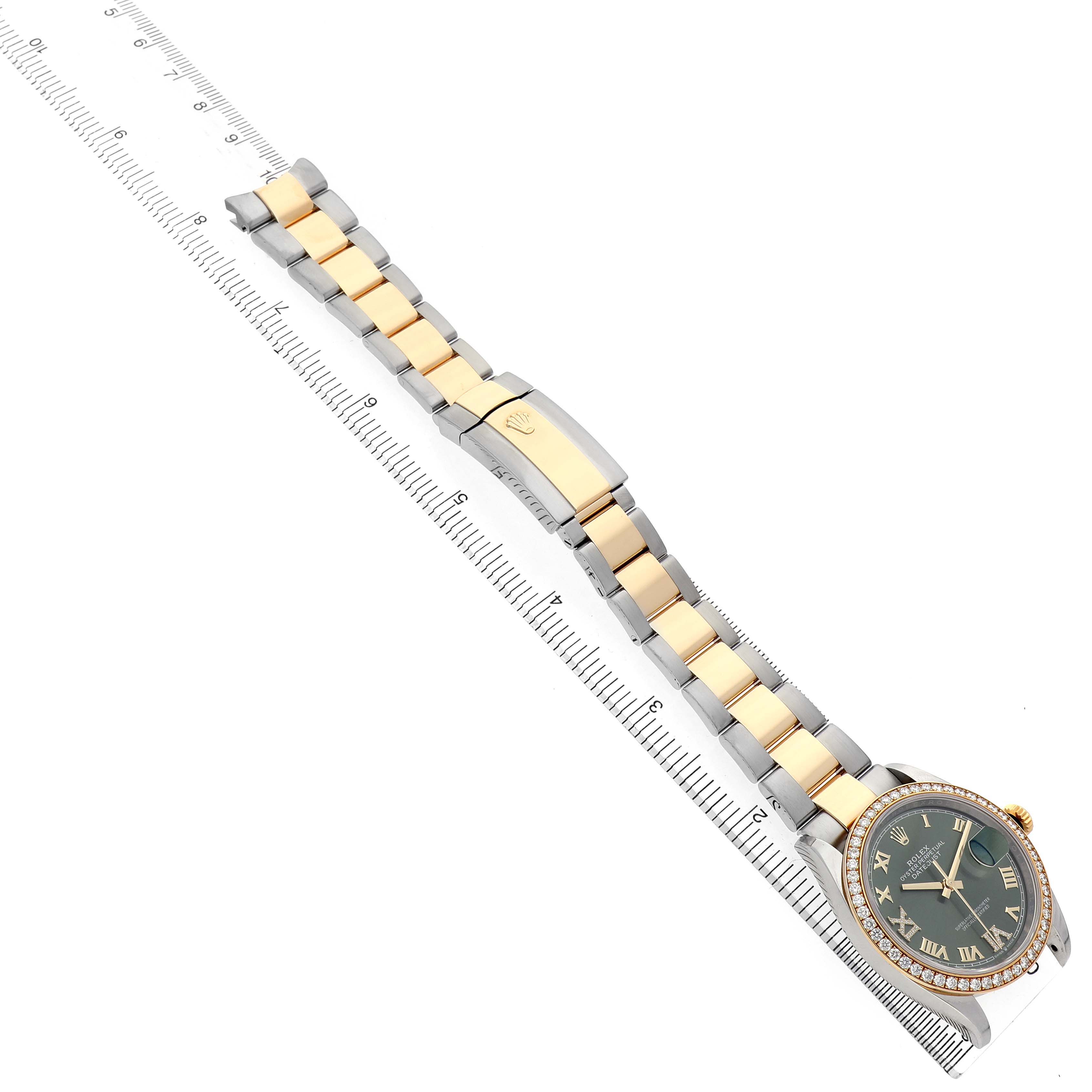 The Rolex Datejust 126283 Women's Steel and Gold (two tone) Green Dial watch is shown from an angled view displaying the full bracelet and face alongside a measuring scale.