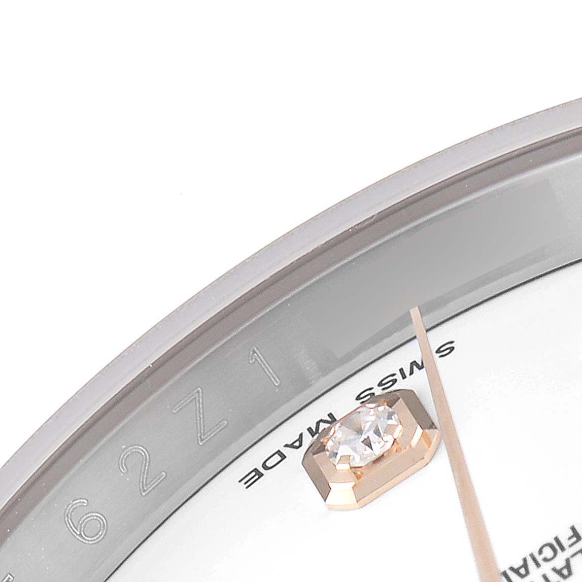 This close-up image shows a portion of the Rolex Datejust 116231 Men's Steel and Gold (two tone) White Dial 116231 Men's Steel and Gold (two tone) White Dial watch face, focusing on a diamond hour marker and part of the dial.