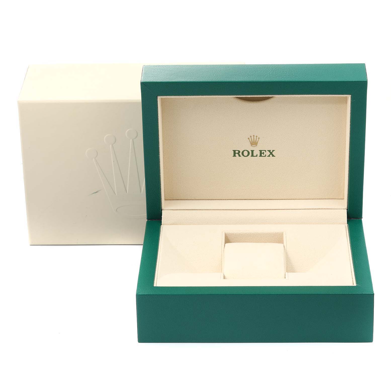 The image shows an open green and beige Rolex box for the Datejust model with the Rolex logo inside.