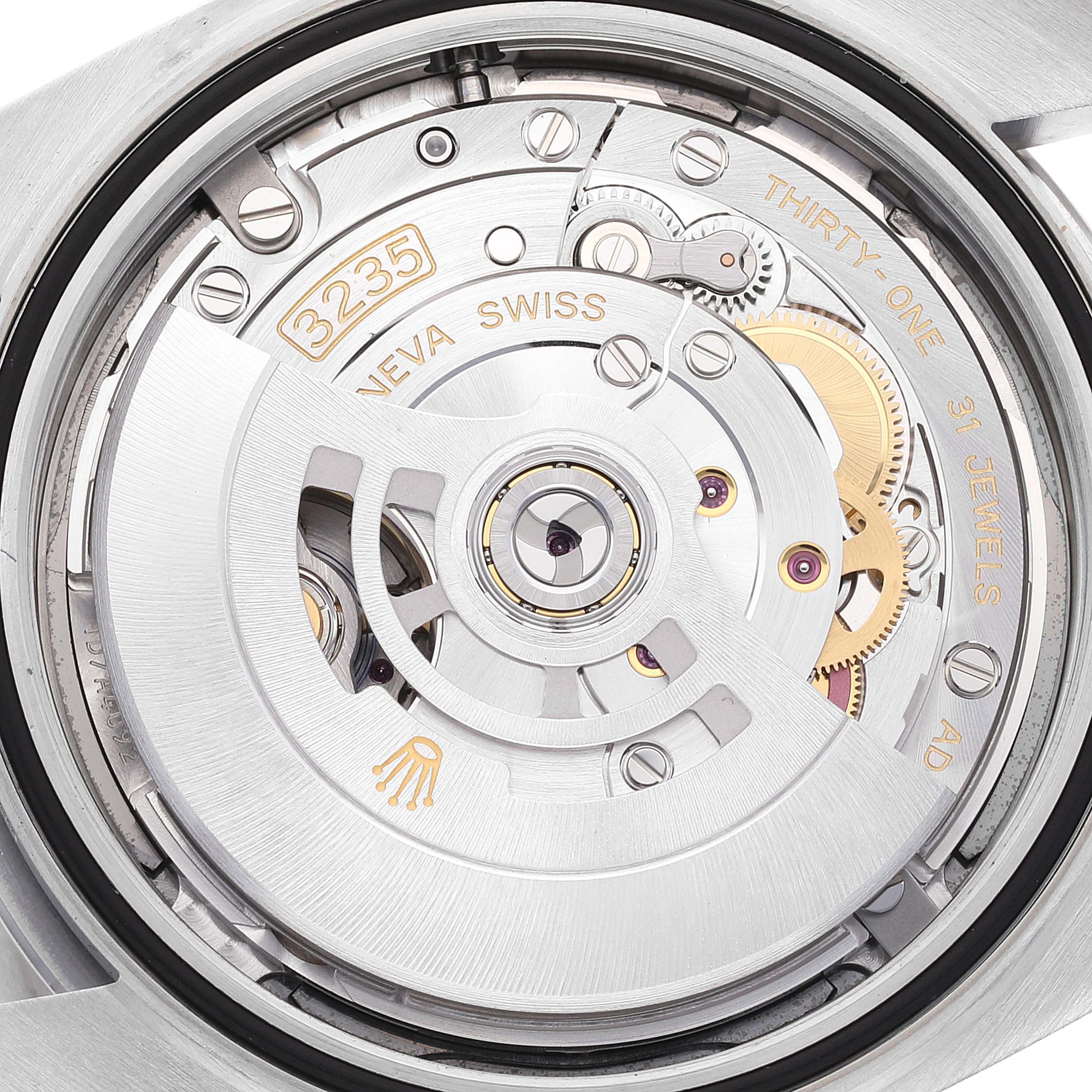 The image shows the movement mechanism of a Rolex Datejust 41 126300 Men's Stainless Steel Grey Dial 126300 Men's Stainless Steel Grey Dial watch, specifically showcasing the intricate gears and jewels.