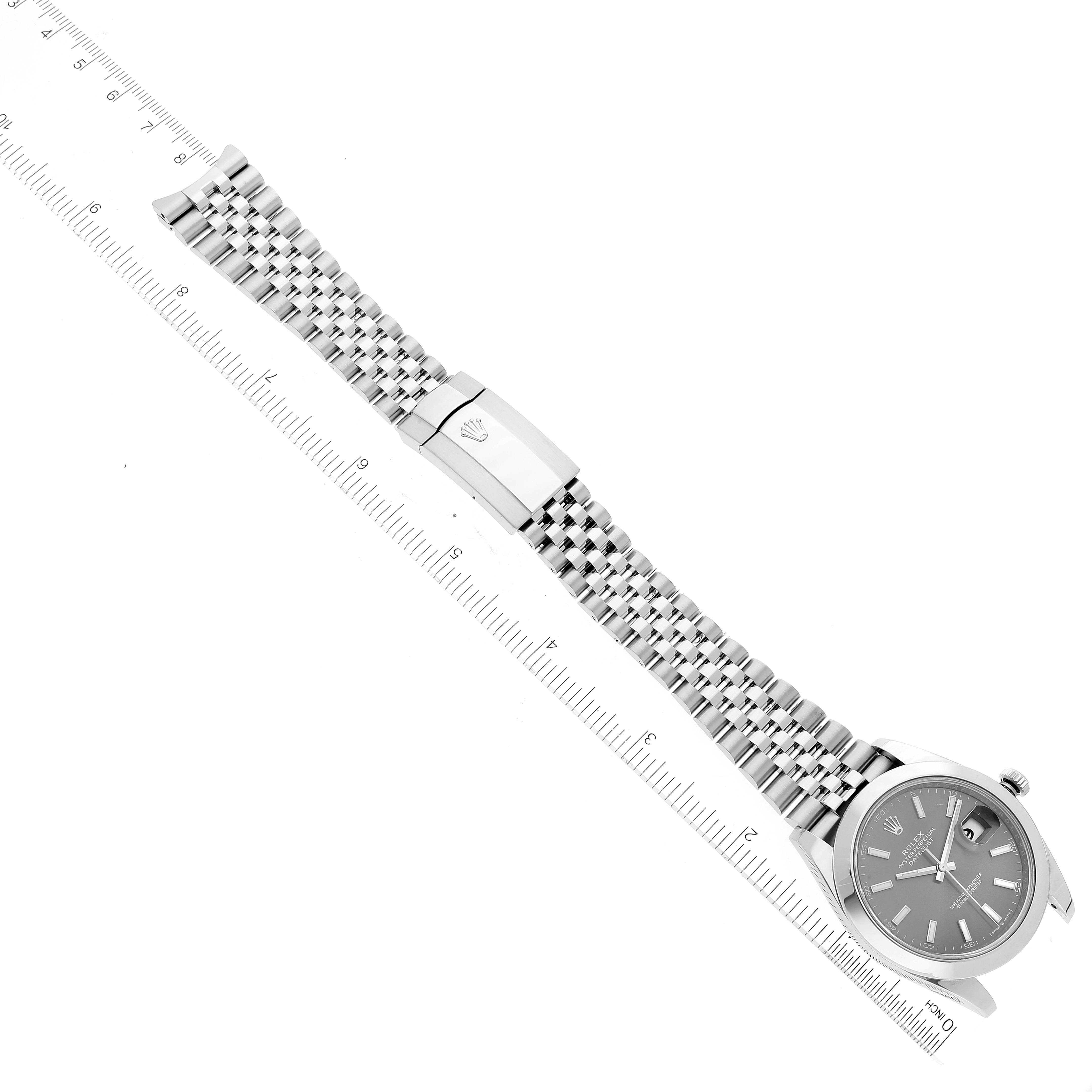 The image shows a Rolex Datejust 41 126300 Men's Stainless Steel Grey Dial 126300 Men's Stainless Steel Grey Dial watch laid flat with its bracelet fully extended, alongside a ruler for scale.