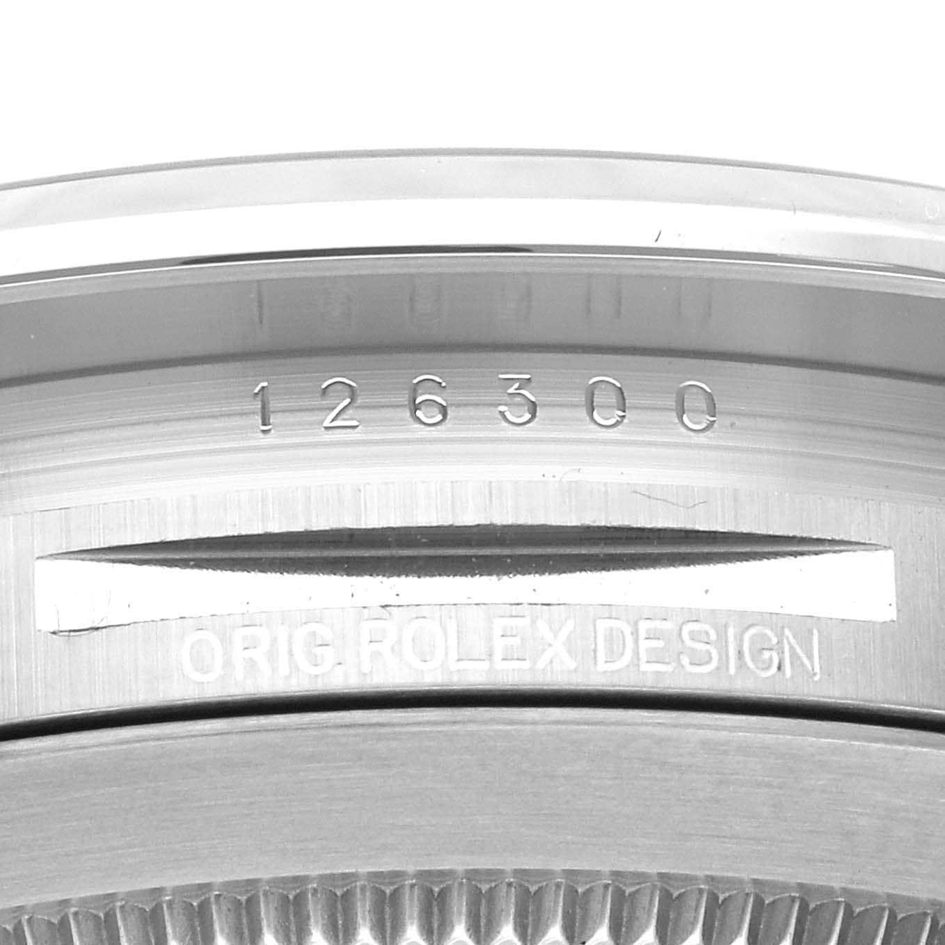 This image shows a close-up of the engraved model number and "Orig Rolex Design" on the case of a Rolex Datejust 41 126300 Men
s Stainless Steel Grey Dial 126300 Men
s Stainless Steel Grey Dial.
