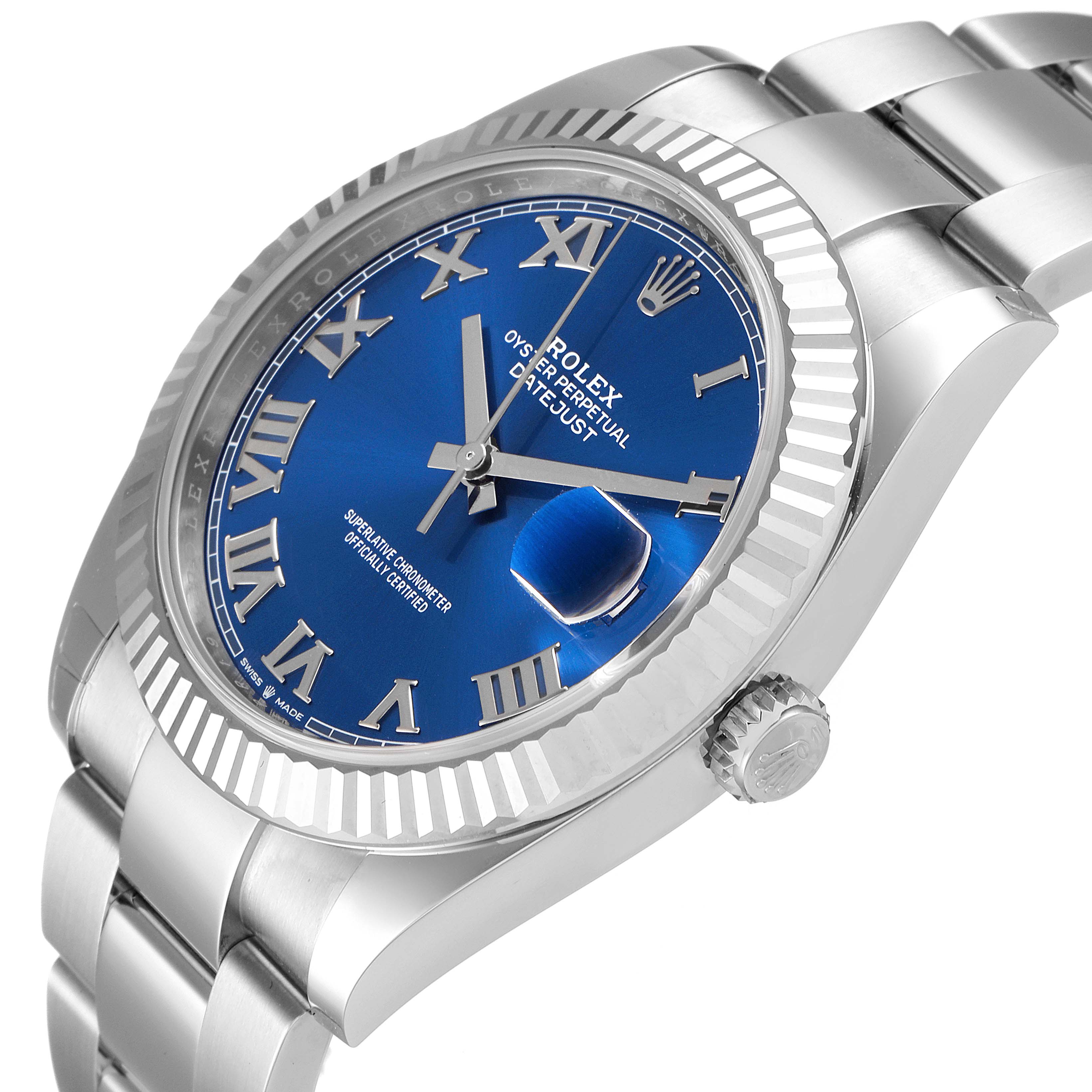 The image shows a Rolex Datejust 41 126334 Men
s Stainless Steel Blue Dial 126334 Men
s Stainless Steel Blue Dial watch at an angled close-up, highlighting its blue dial, silver Roman numerals, fluted bezel, and bracelet.