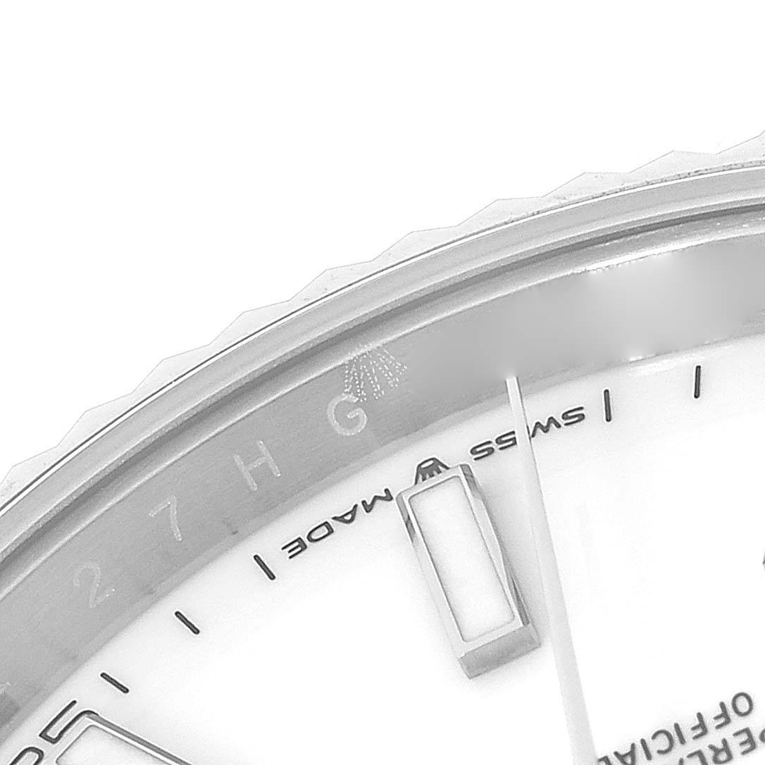 The image shows a close-up of the face and bezel of a Rolex Datejust 41 126334 Men's Stainless Steel White Dial 126334 Men's Stainless Steel White Dial watch, highlighting part of the dial and markers.