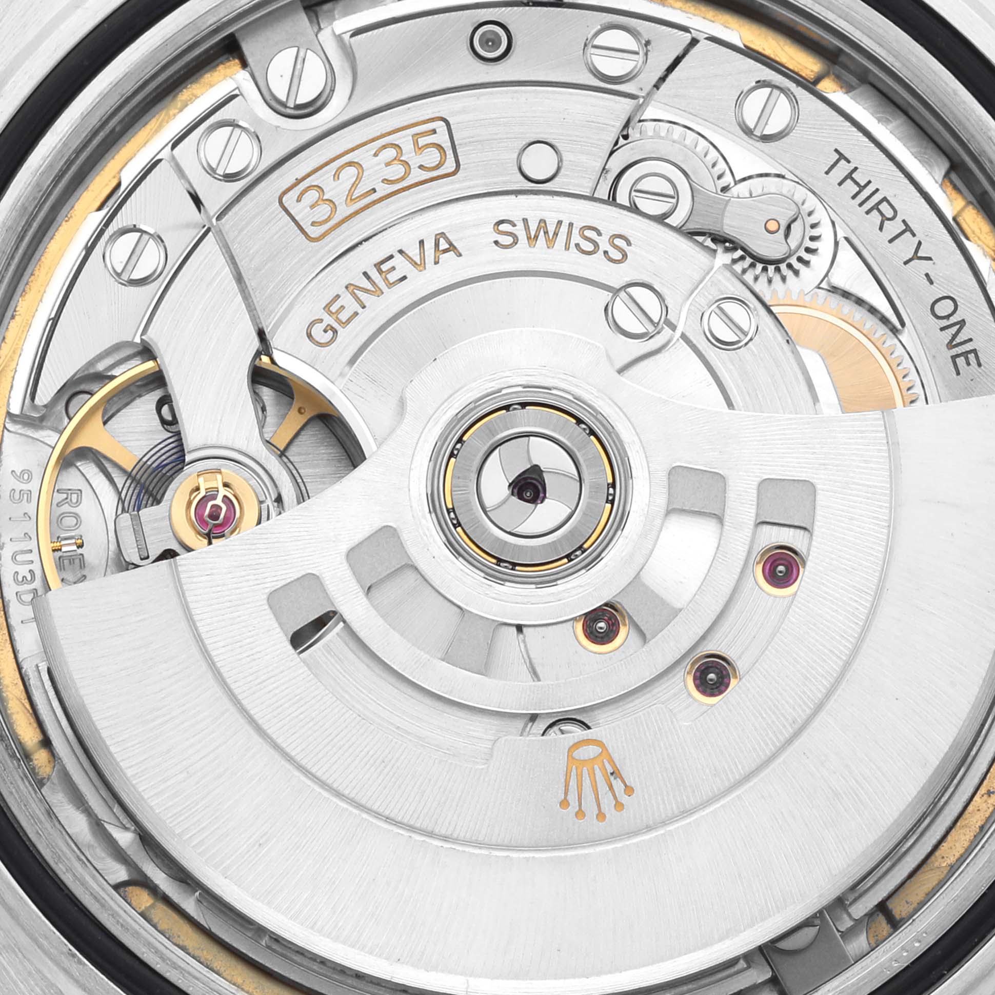 Close-up view of the movement mechanism in a Rolex Datejust 41 126300 Men's Stainless Steel White Dial 126300 Men's Stainless Steel White Dial watch, displaying intricate components and engravings.