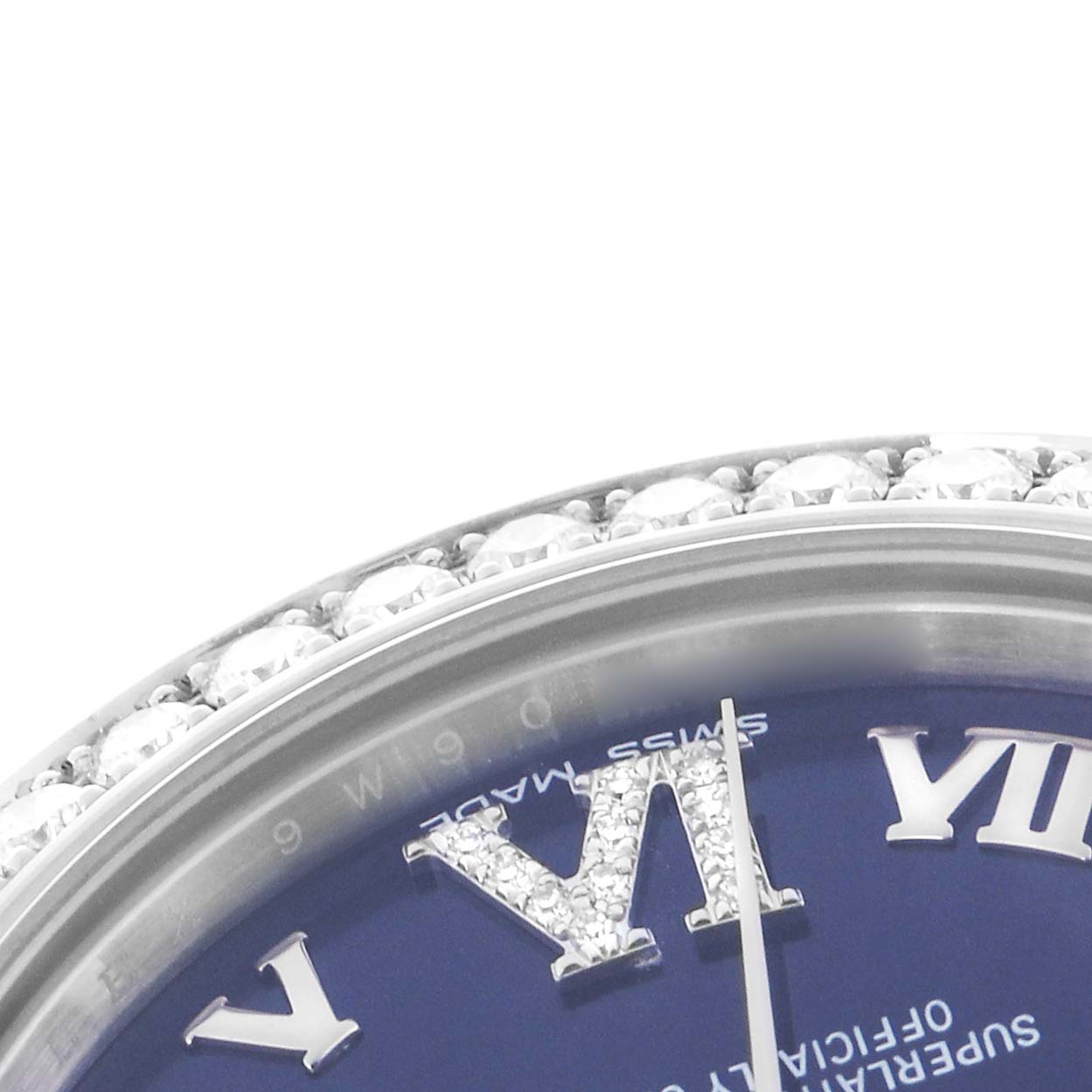 The image shows a close-up of the Rolex Mid-Size 178384 Women
s Stainless Steel Purple Dial 178384 Women
s Stainless Steel Purple Dial watch face, highlighting the diamond-encrusted Roman numerals and bezel.