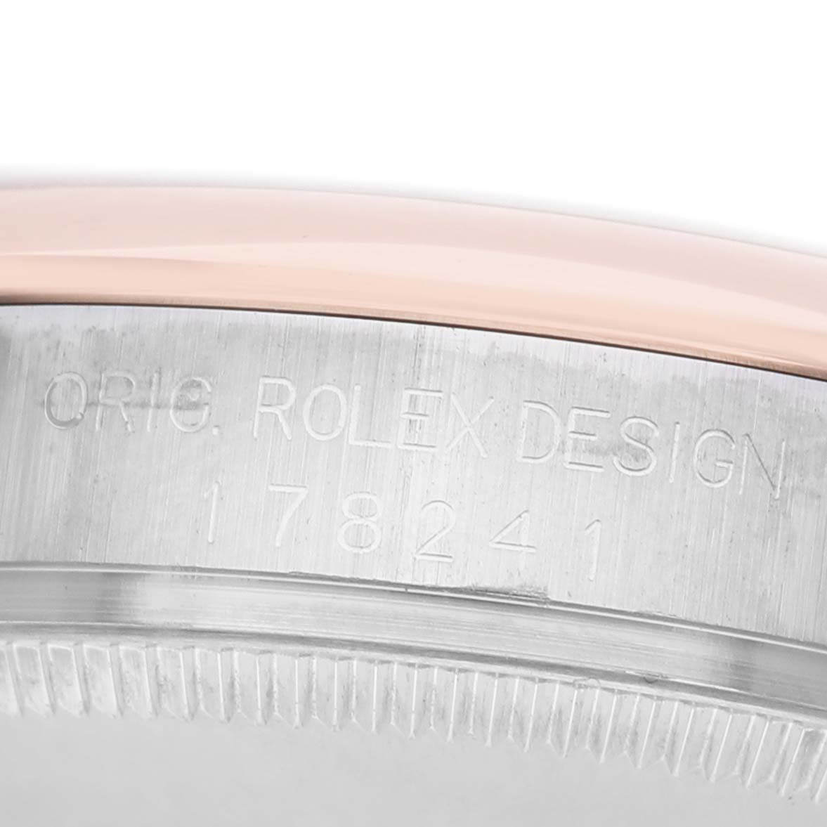The image shows a close-up of the case side with engravings on the Rolex Mid-Size 178241 Women's Steel and Gold (two tone) Pink Dial model, including "ORIG. ROLEX DESIGN 178241".