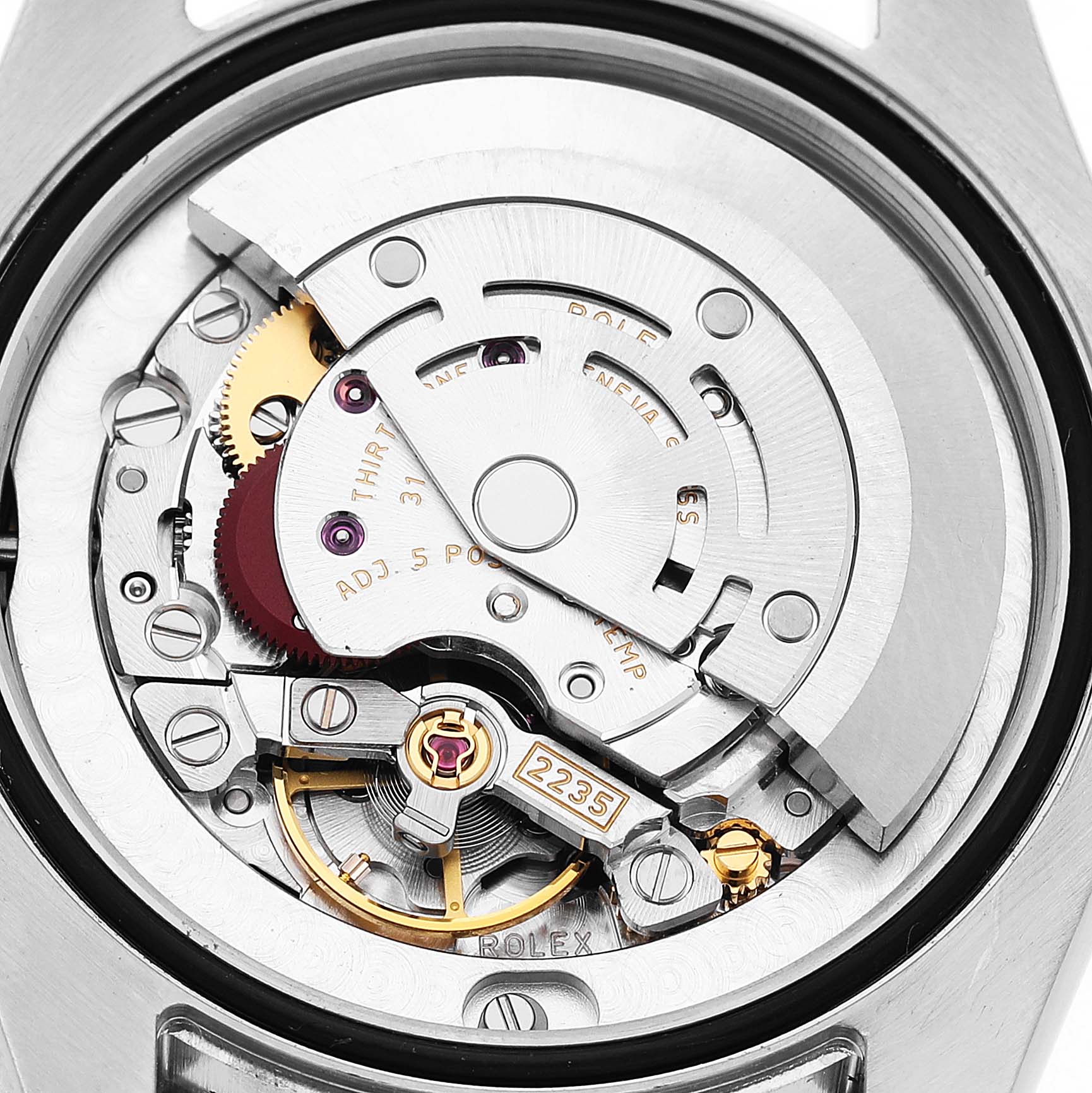 The image shows the internal movement of a Rolex Mid-Size 178344 Women's Stainless Steel Mother of Pearl Dial model, viewed from the back, highlighting gears and the rotor.