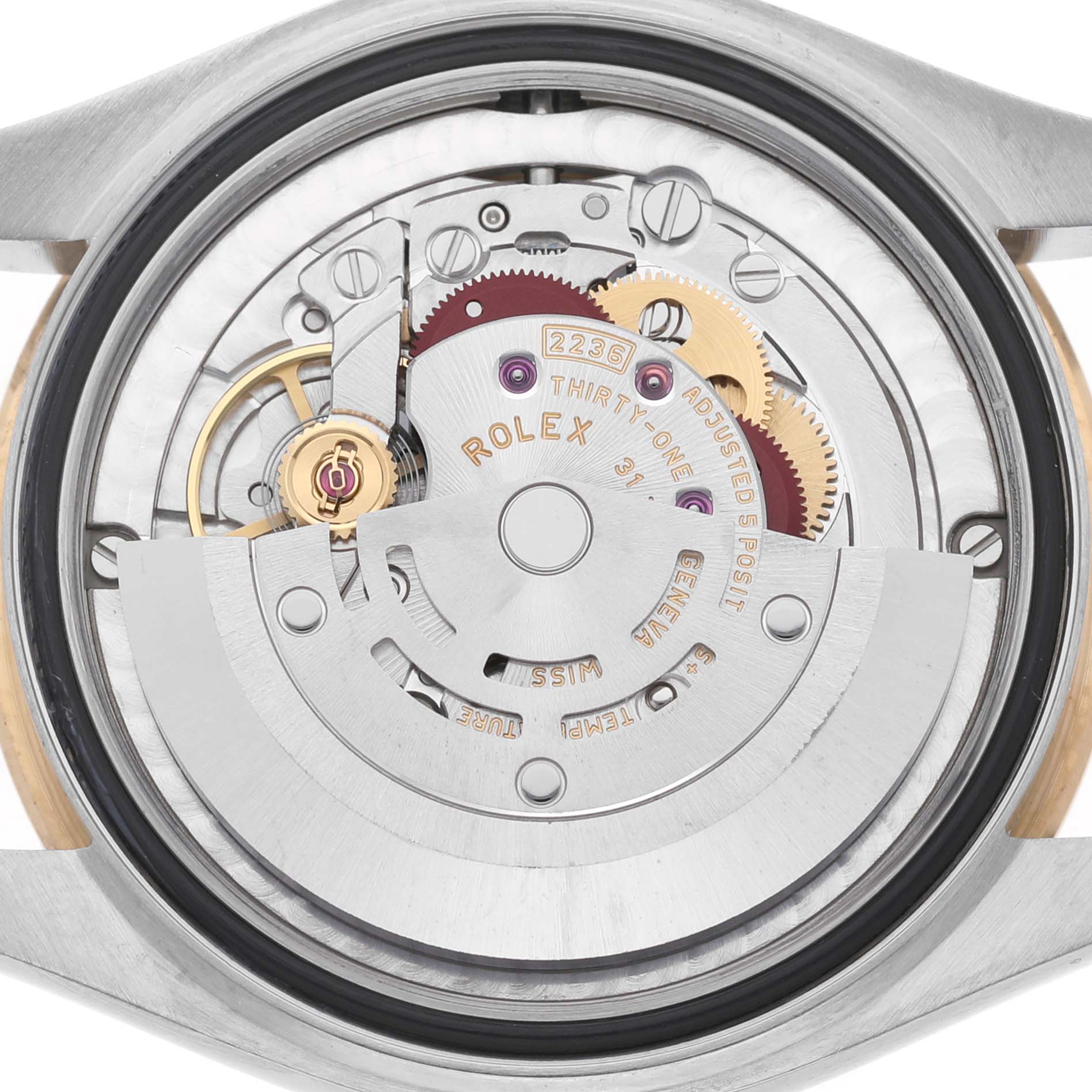 The image shows the internal mechanism of a Rolex Mid-Size 278273 Women's Steel and Gold (two tone) White Dial watch from a back view, highlighting gears and movement parts.