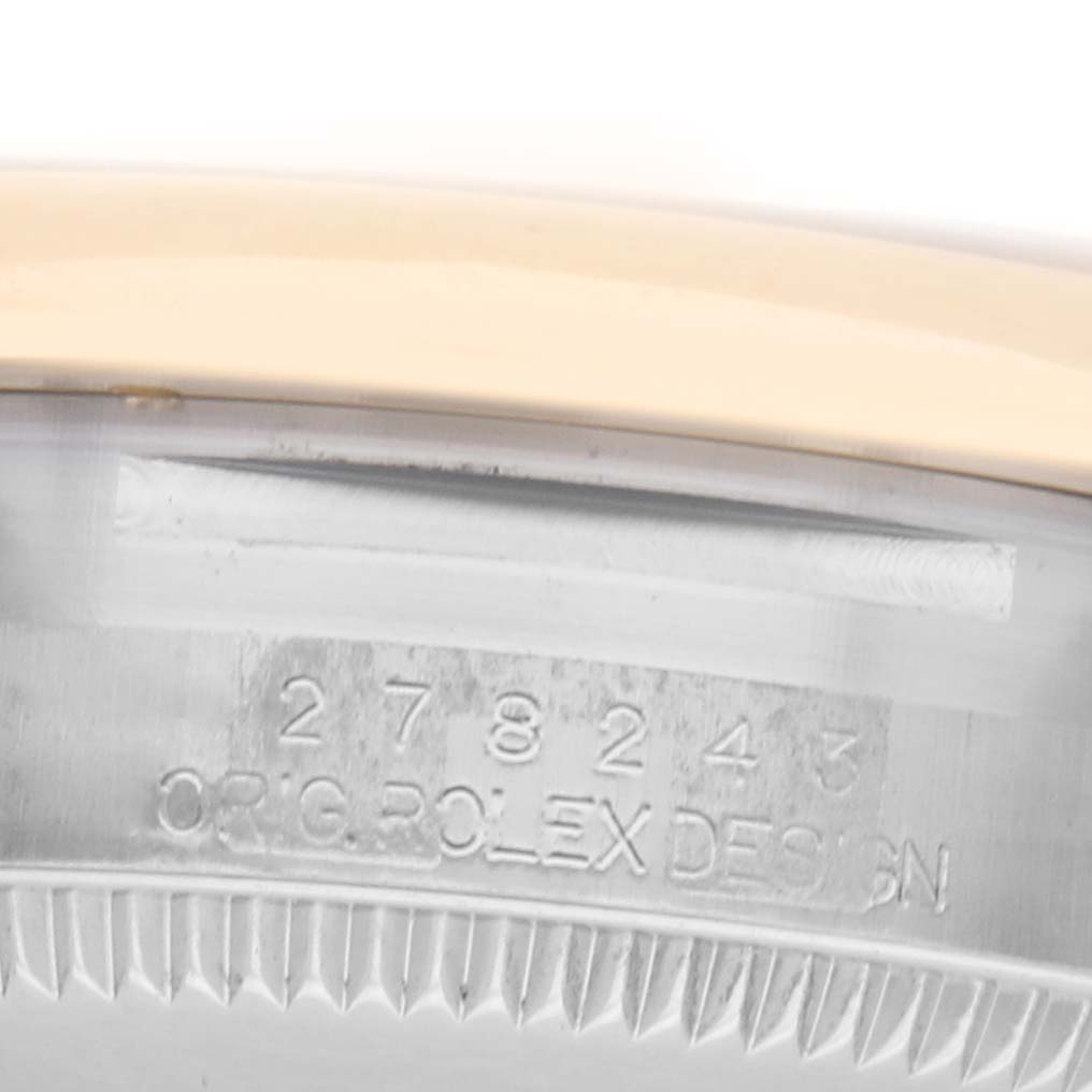 This close-up image shows the engraved side of the casing of a Rolex Datejust 278243 Women's Steel and Gold (two tone) Silver Dial 278243 Women's Steel and Gold (two tone) Silver Dial watch.