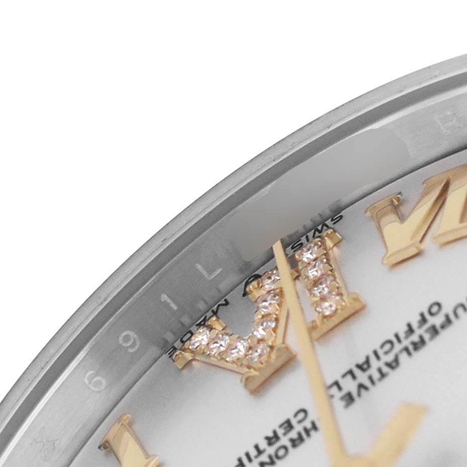 The image shows a close-up of the dial and bezel edge of a Rolex Mid-Size 278273 Women's Steel and Gold (two tone) Silver Dial watch, highlighting the numeral and decorations.
