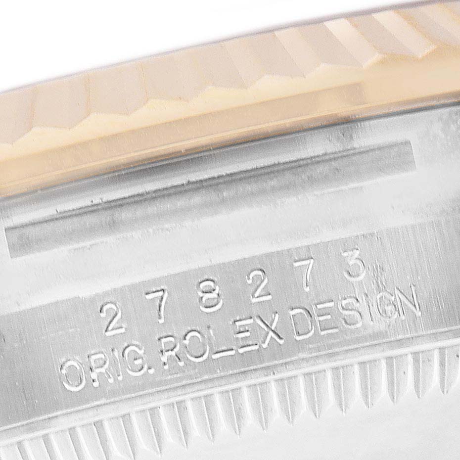 The image shows a close-up of the engraving on the side of a Mid-Size Rolex watch case with "ORIG ROLEX DESIGN" and a serial number.