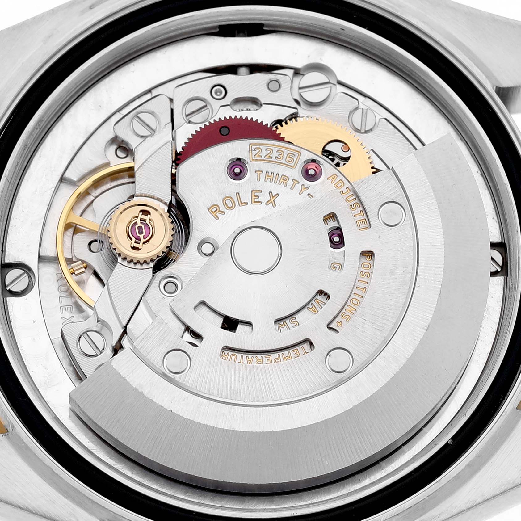 The image shows the movement of a Rolex Mid-Size 278273 Women's Steel and Gold (two tone) Silver Dial model, highlighting gears and the rotor from a top view.