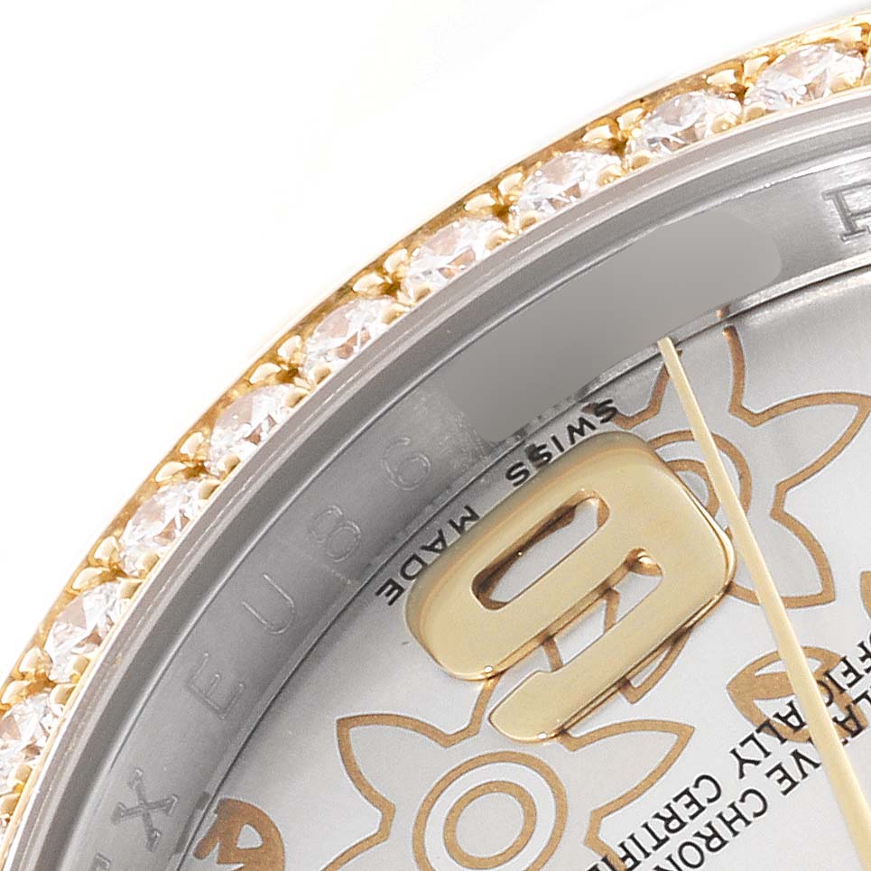 The image shows a close-up of the bezel and part of the dial of a Rolex Datejust 116243 Men's Steel and Gold (two tone) Silver Dial 116243 Men's Steel and Gold (two tone) Silver Dial, featuring a jeweled edge and partial numbering.