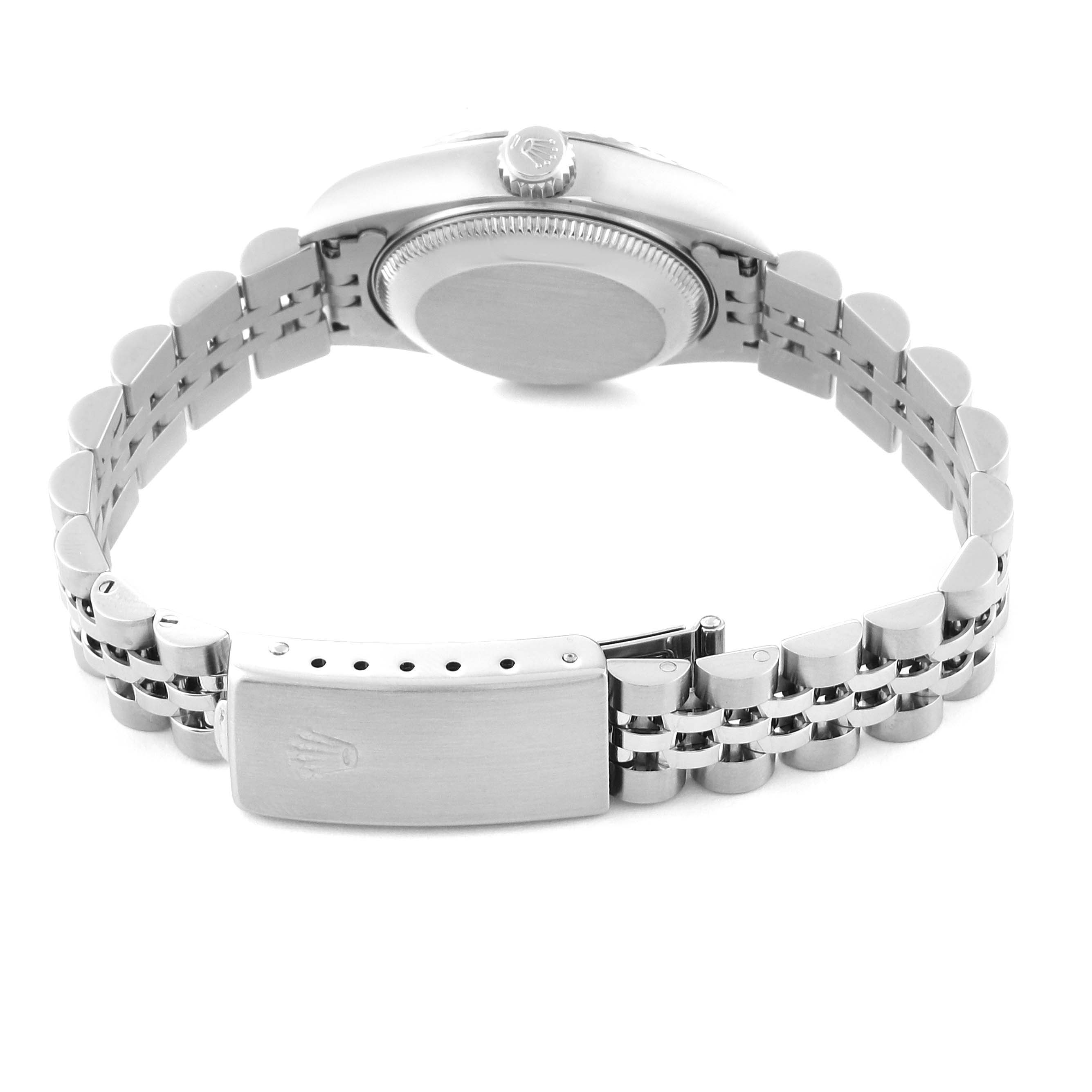 The image shows the back view of a Rolex Datejust 79174 Women's Stainless Steel Black Dial 79174 Women's Stainless Steel Black Dial watch, highlighting the case back, crown, and Jubilee bracelet with a clasp.