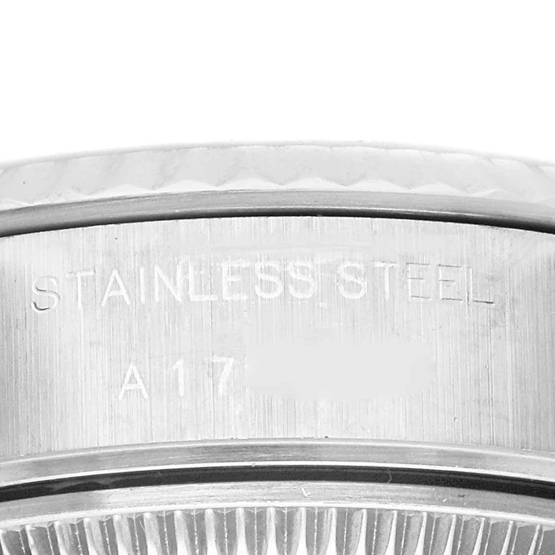 This close-up angle of the Rolex Datejust 79174 Women's Stainless Steel Black Dial 79174 Women's Stainless Steel Black Dial watch displays the engraved stainless steel case.
