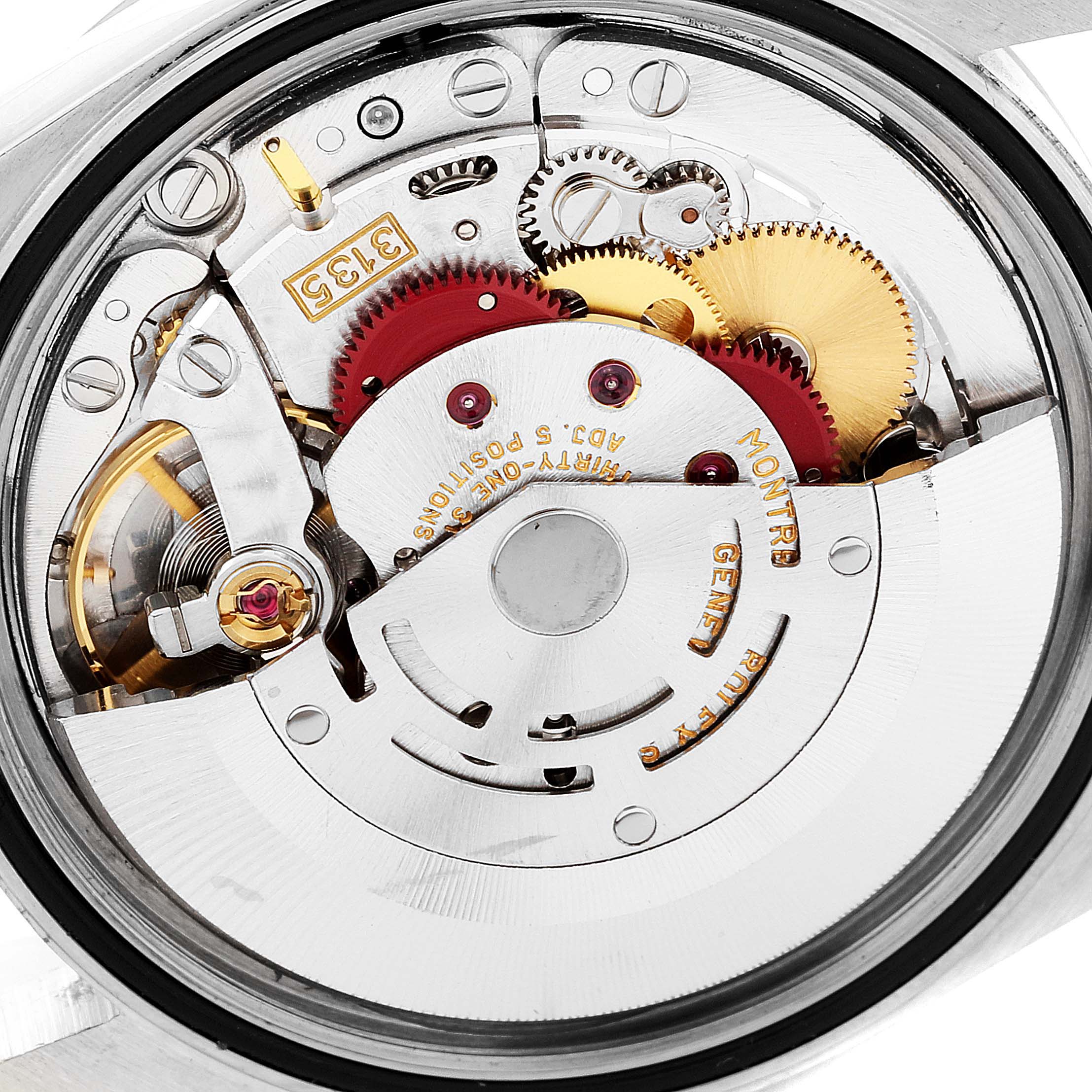 This image shows a close-up view of the internal mechanism of a Rolex Datejust 16234 Men's Stainless Steel Black Dial 16234 Men's Stainless Steel Black Dial watch, displaying gears and components in the movement.