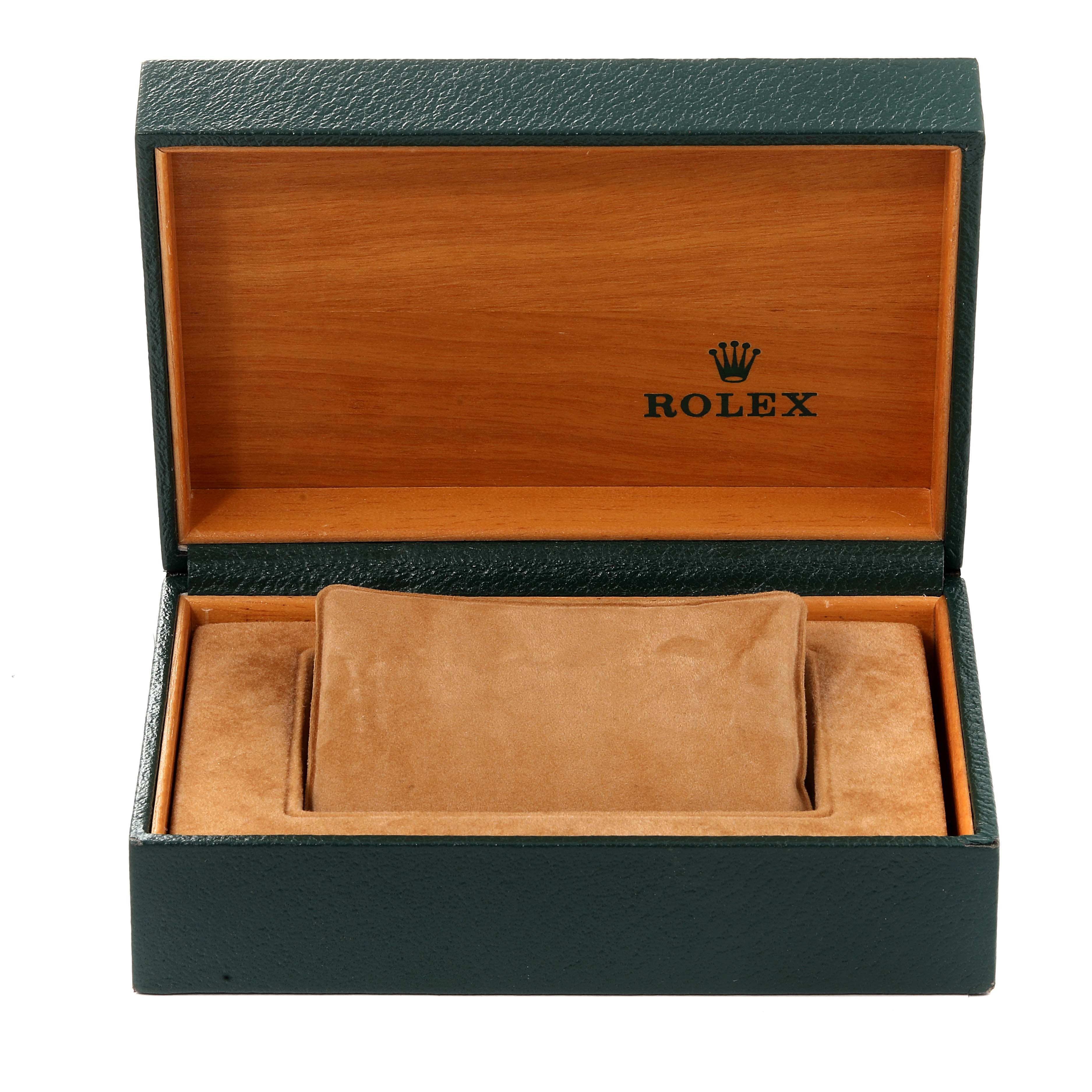 This is an open Rolex Datejust 16234 Men's Stainless Steel Black Dial 16234 Men's Stainless Steel Black Dial watch box, revealing a wood interior and a soft, beige cushion for holding the watch.