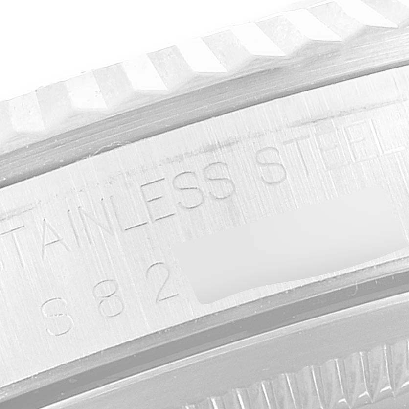 The close-up image shows the engraved text and fluted bezel of a Rolex Datejust 16234 Men's Stainless Steel Black Dial 16234 Men's Stainless Steel Black Dial watch.